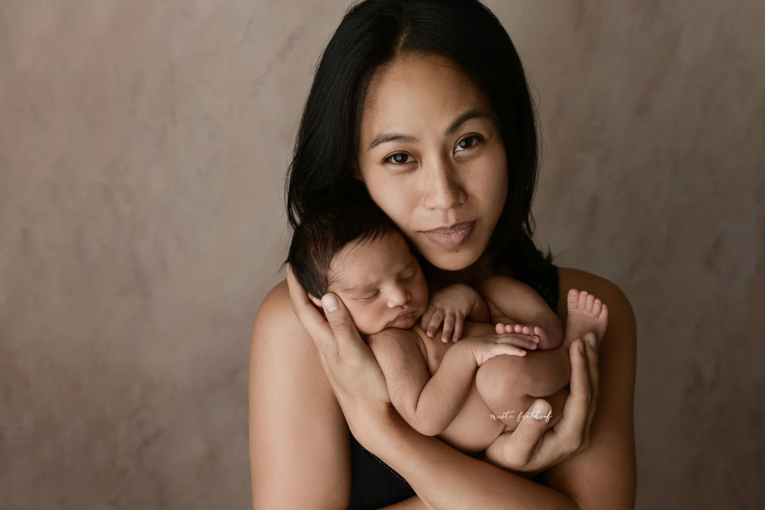 Beautiful image captured of this newborn baby and mom in Austin Texas at Misti Frithiof Photography.