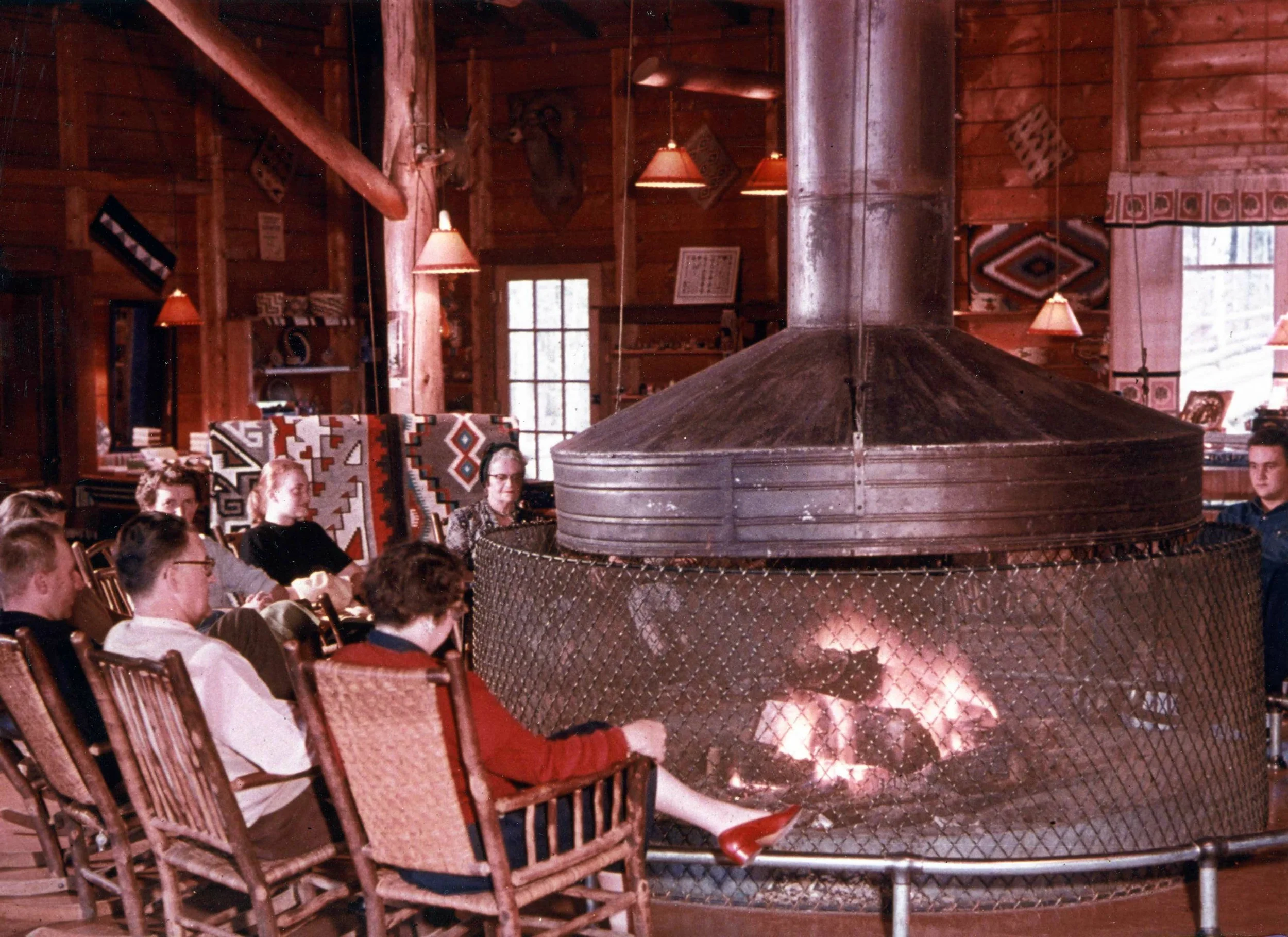 Guests enjoying the lobby fireplace at the Grand Lake Lodge
