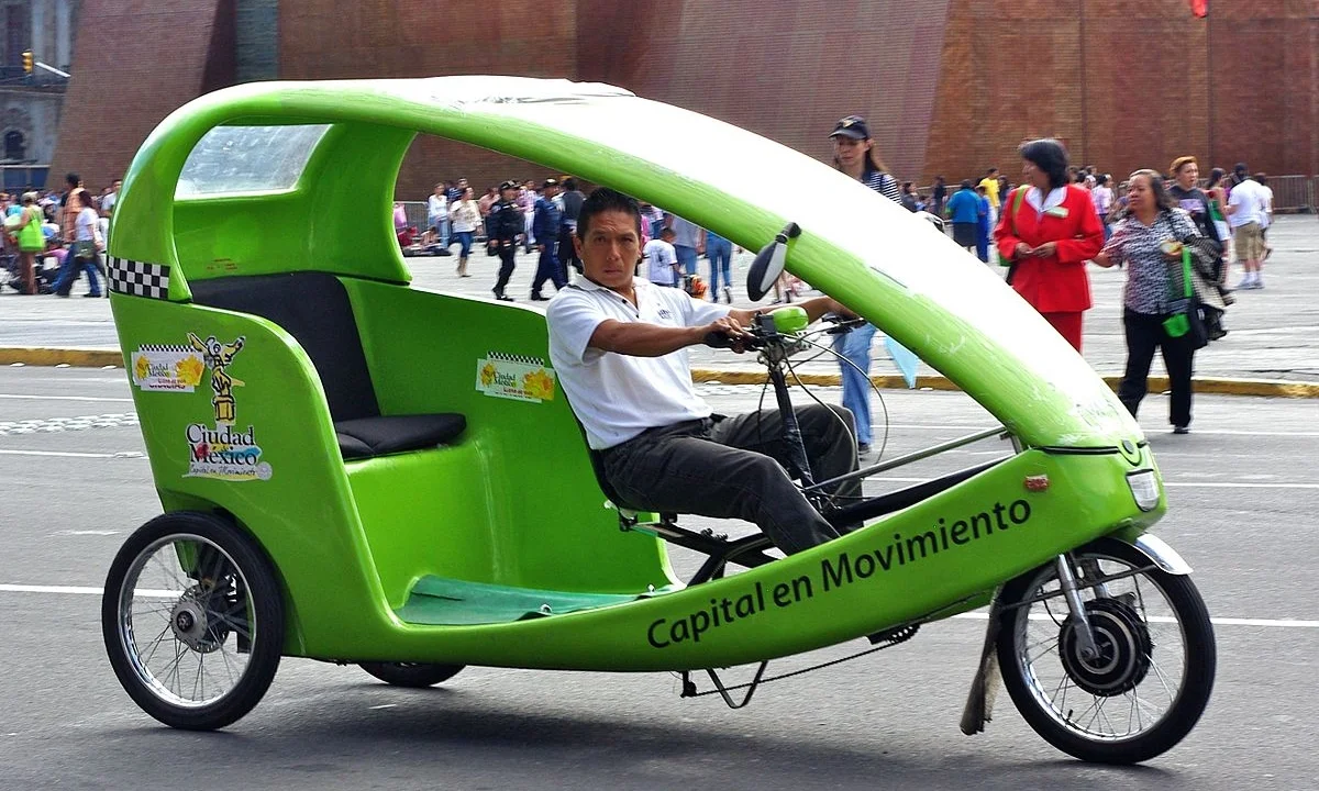 A closed shell bicycle rickshaw. Dave would be happier than this guy.