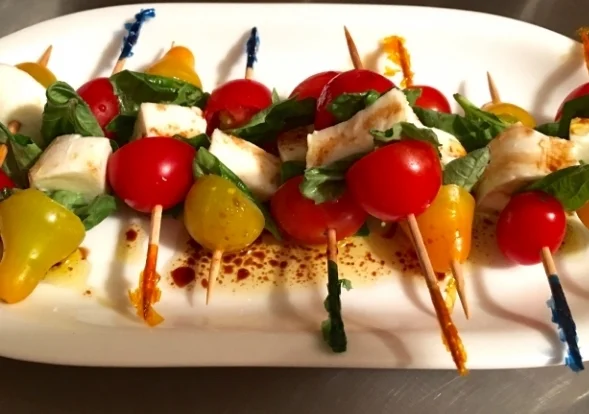 A festive and fun way to serve mini portions of Caprese salad