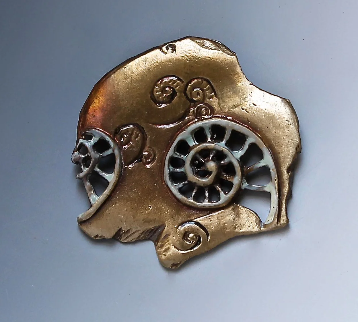 Brass Menagerie Nautilus Fragment pin-pendant.jpg