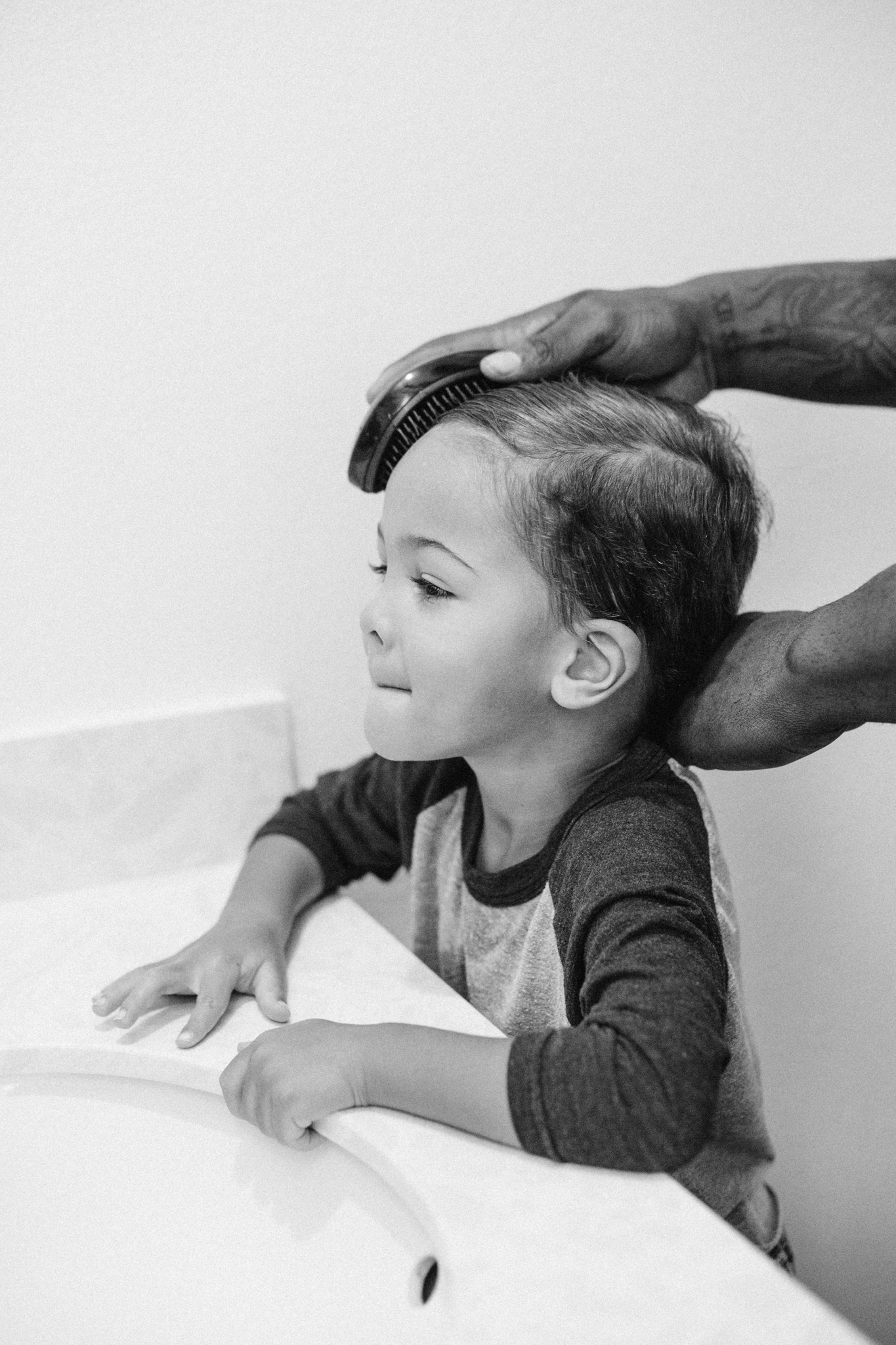 Dad brushing Carson's hair
