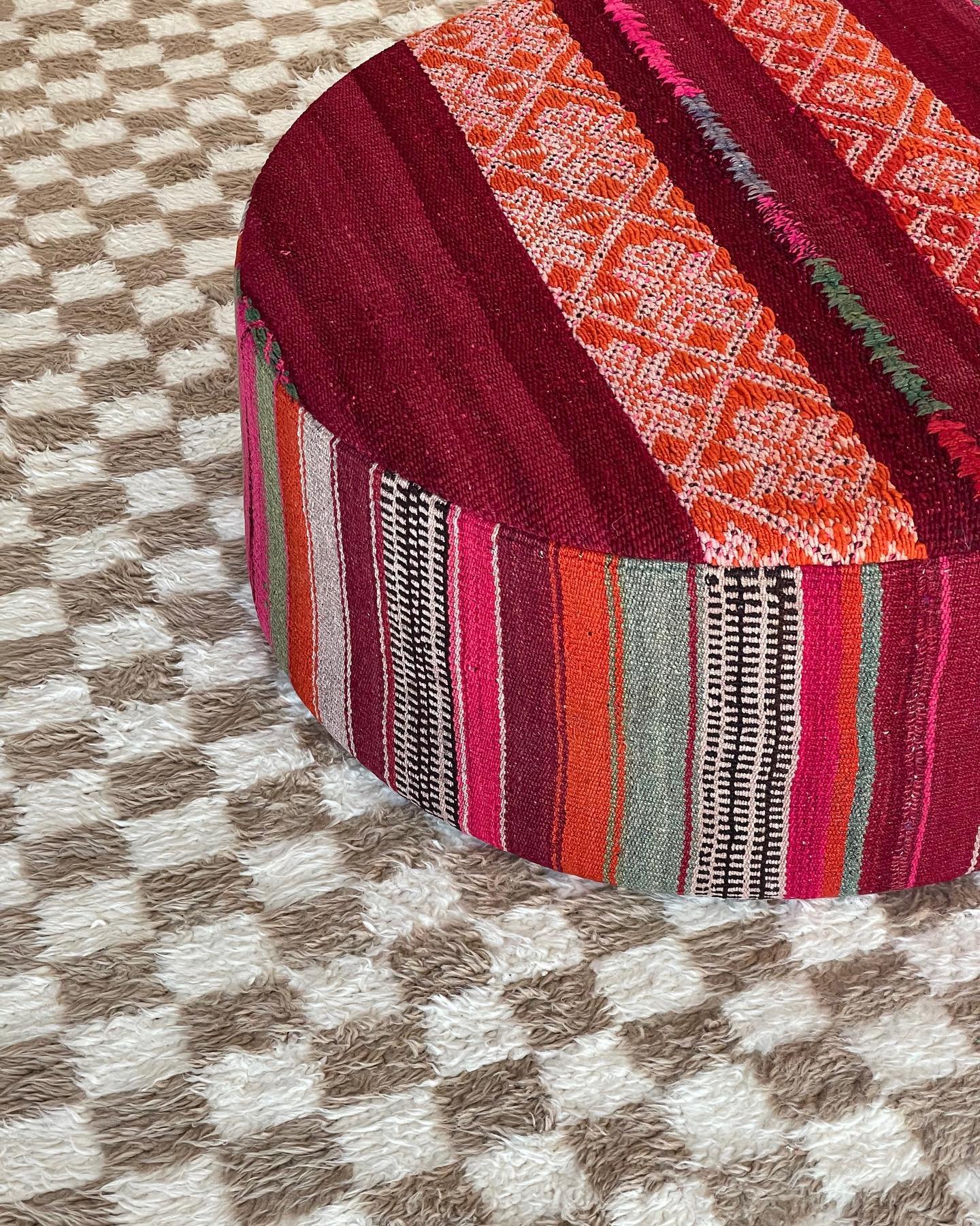 So rewarding to see this beautiful custom ottoman come to life! She&rsquo;s wrapped in two one-of-a-kind vintage Peruvian frazadas which we hand-selected for not only color and size, but also to create the perfect interplay of pattern between top and