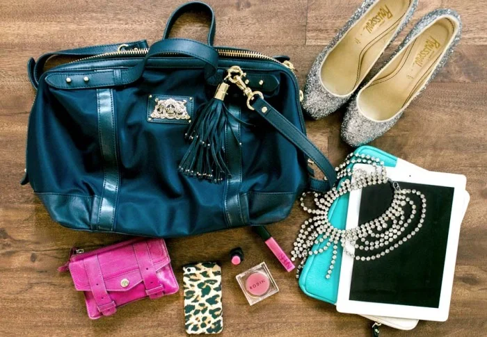 Taylor Sterling carts hers around in Juicy Couture. More tassels.