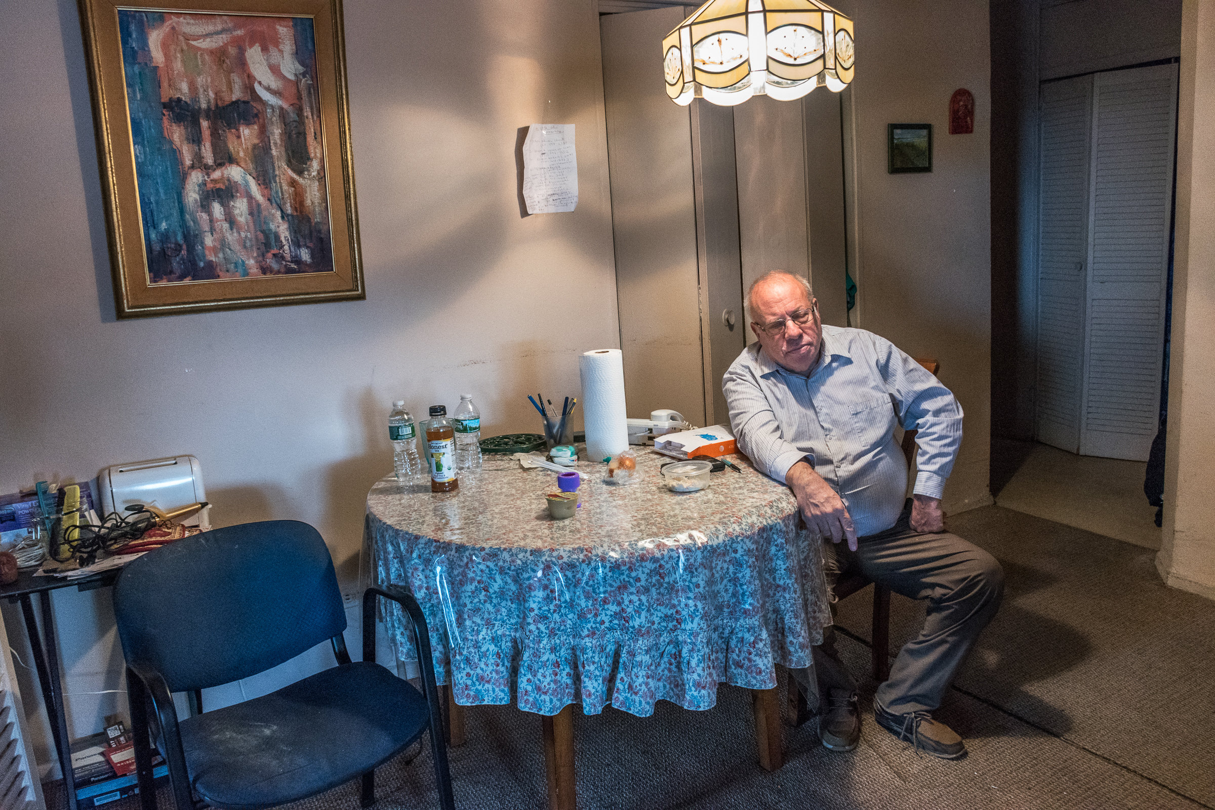 Mar 3, 2017- Brooklyn, N.Y., U.S.A.- Larry rests at the dining room table, he says "without the caregivers, I couldn't do all this". 