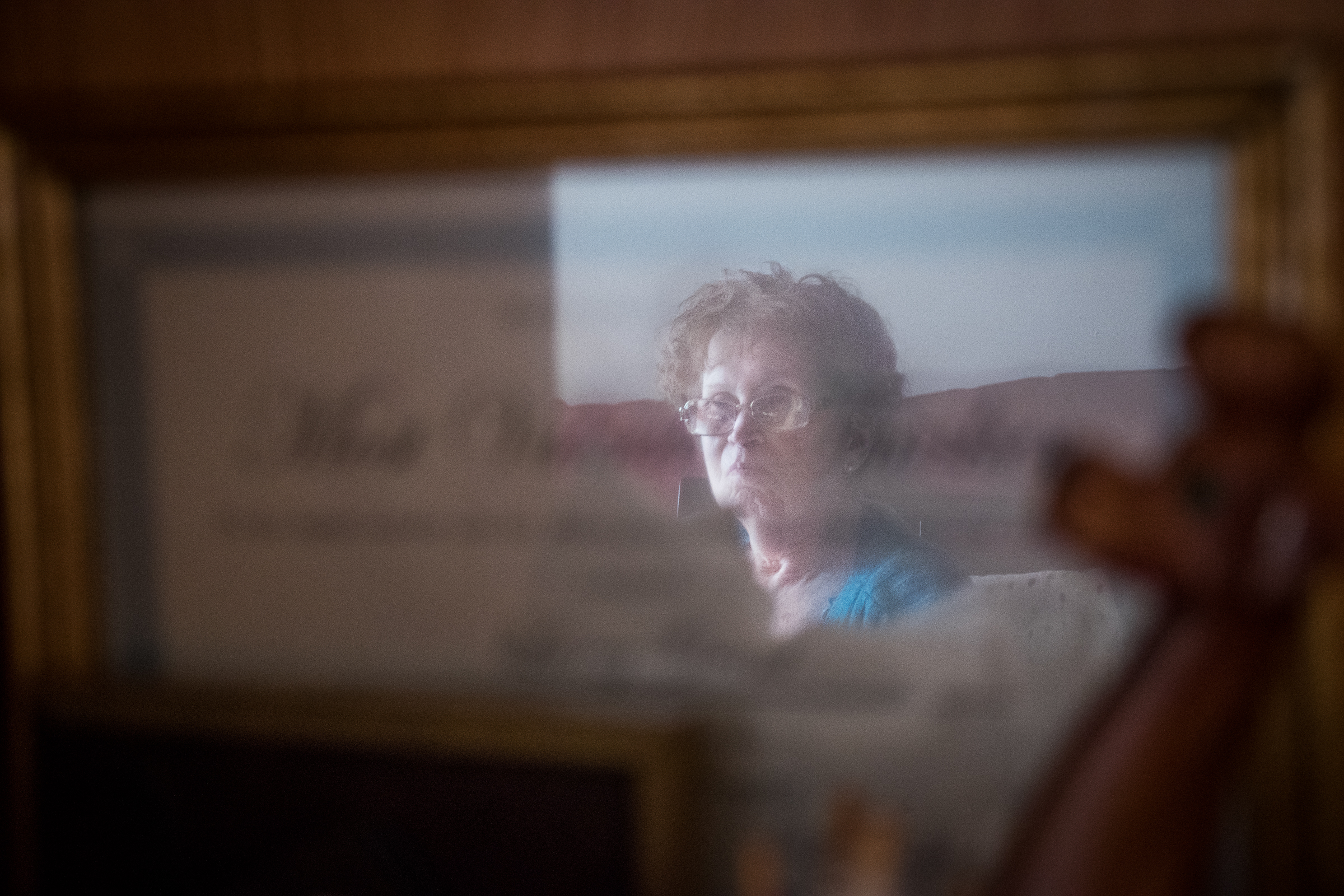 Mar 3, 2017- Brooklyn, N.Y., U.S.A.- Sherry's reflection in a framed certificate awarded to her husband Larry for his leadership involvement and support given to the Brain Injury Association of New York.