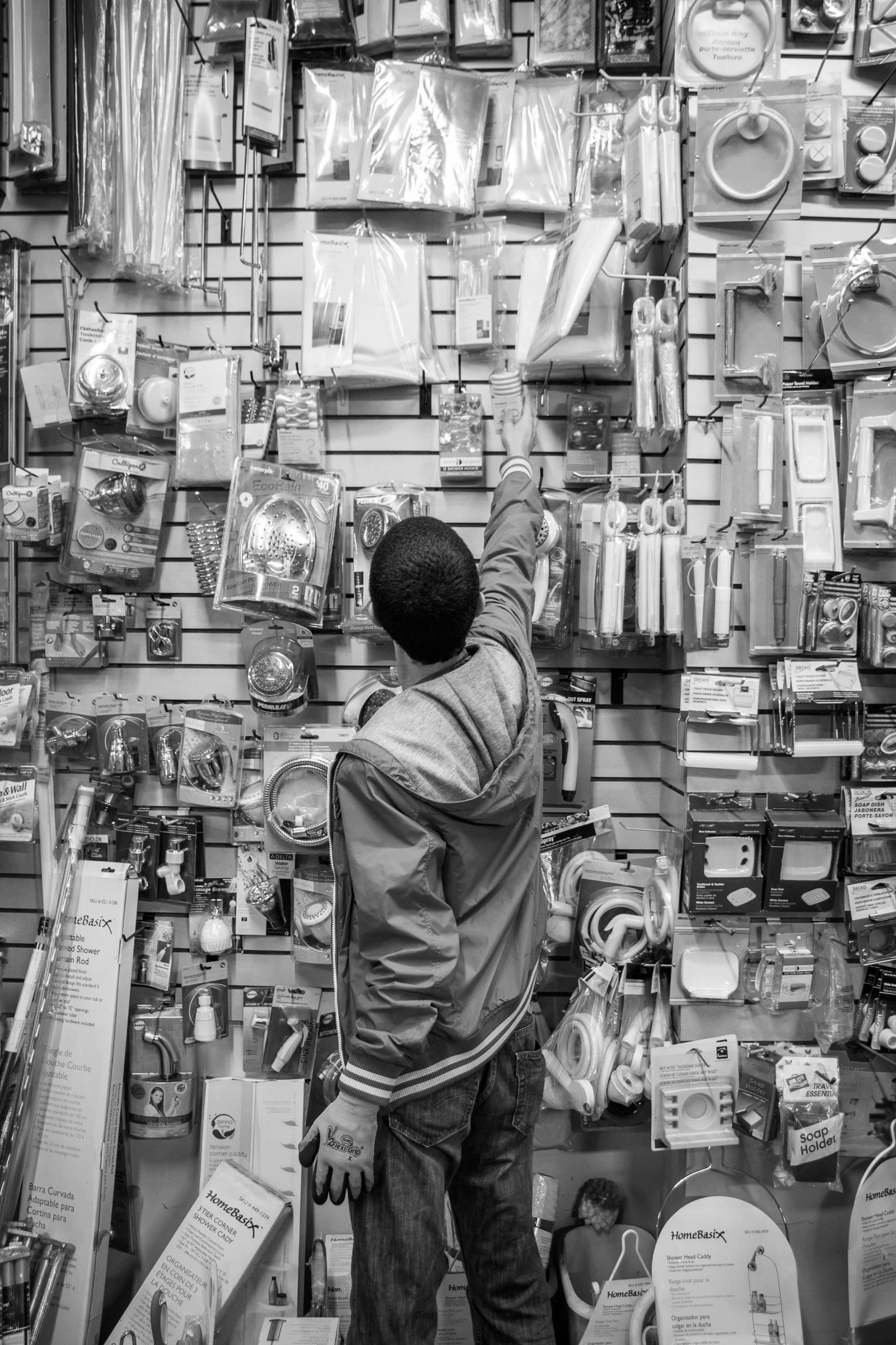 Oct 5, 2016- Brooklyn, N.Y., U.S.A.- Bronson Bernard restocks merchandise during his day shift at Hardware 2.0 in the Clinton Hill neighbourhood. He was fired from his position in November, 2016 due to accusations that he was stealing merchandise.