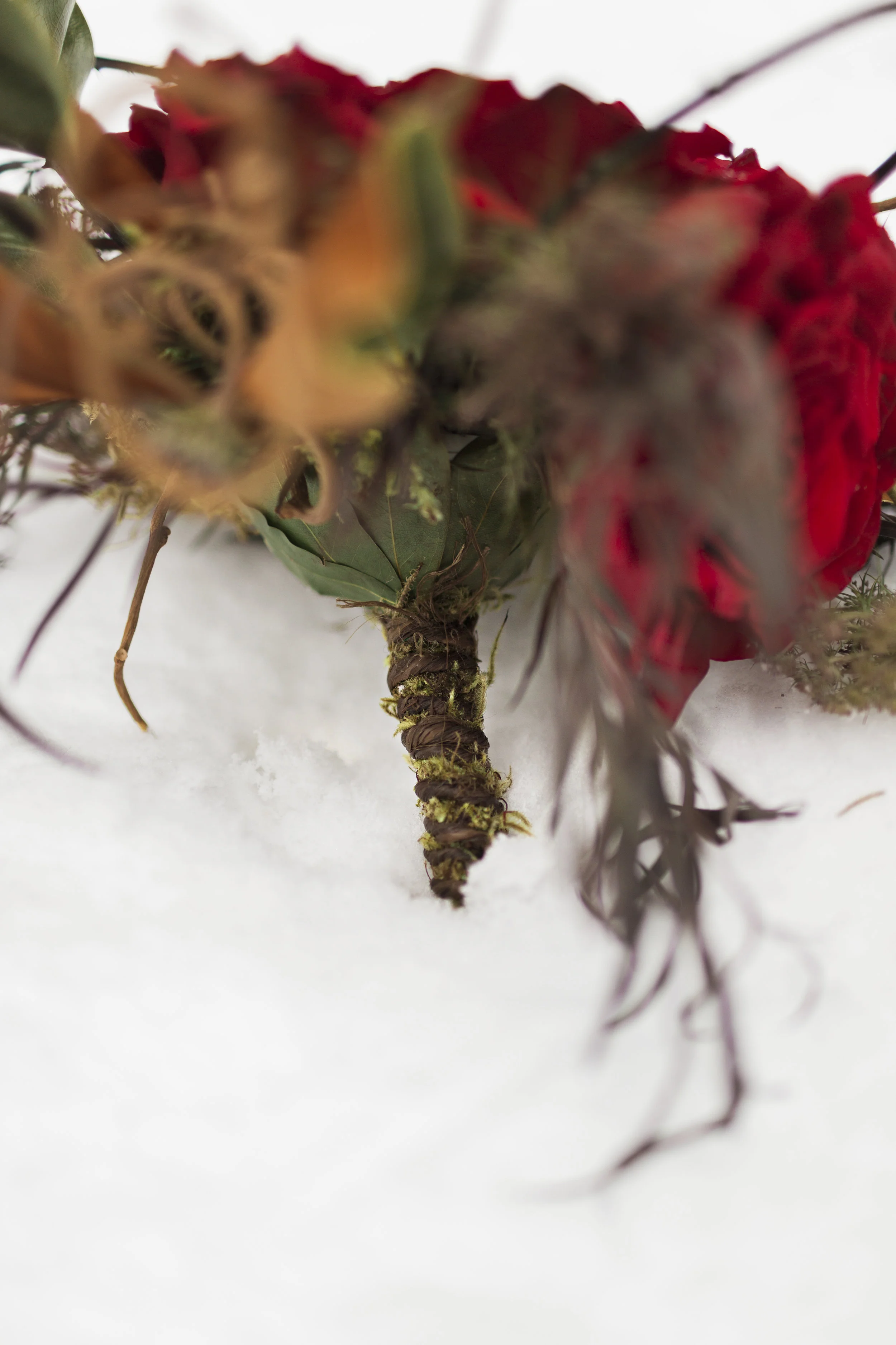 Mossy details on the bouquet handle.