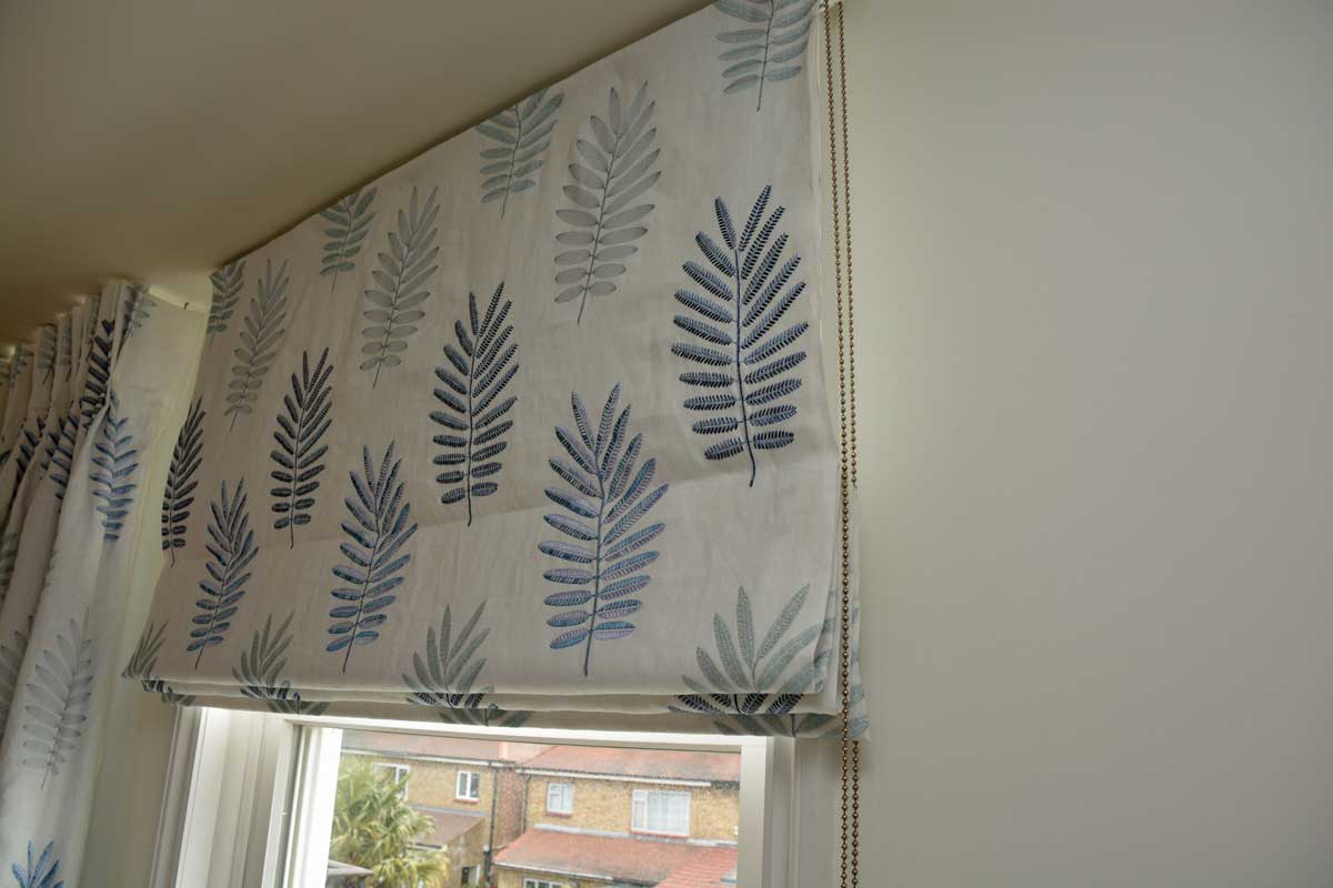 Roman blind with blue/grey leaf print fabric