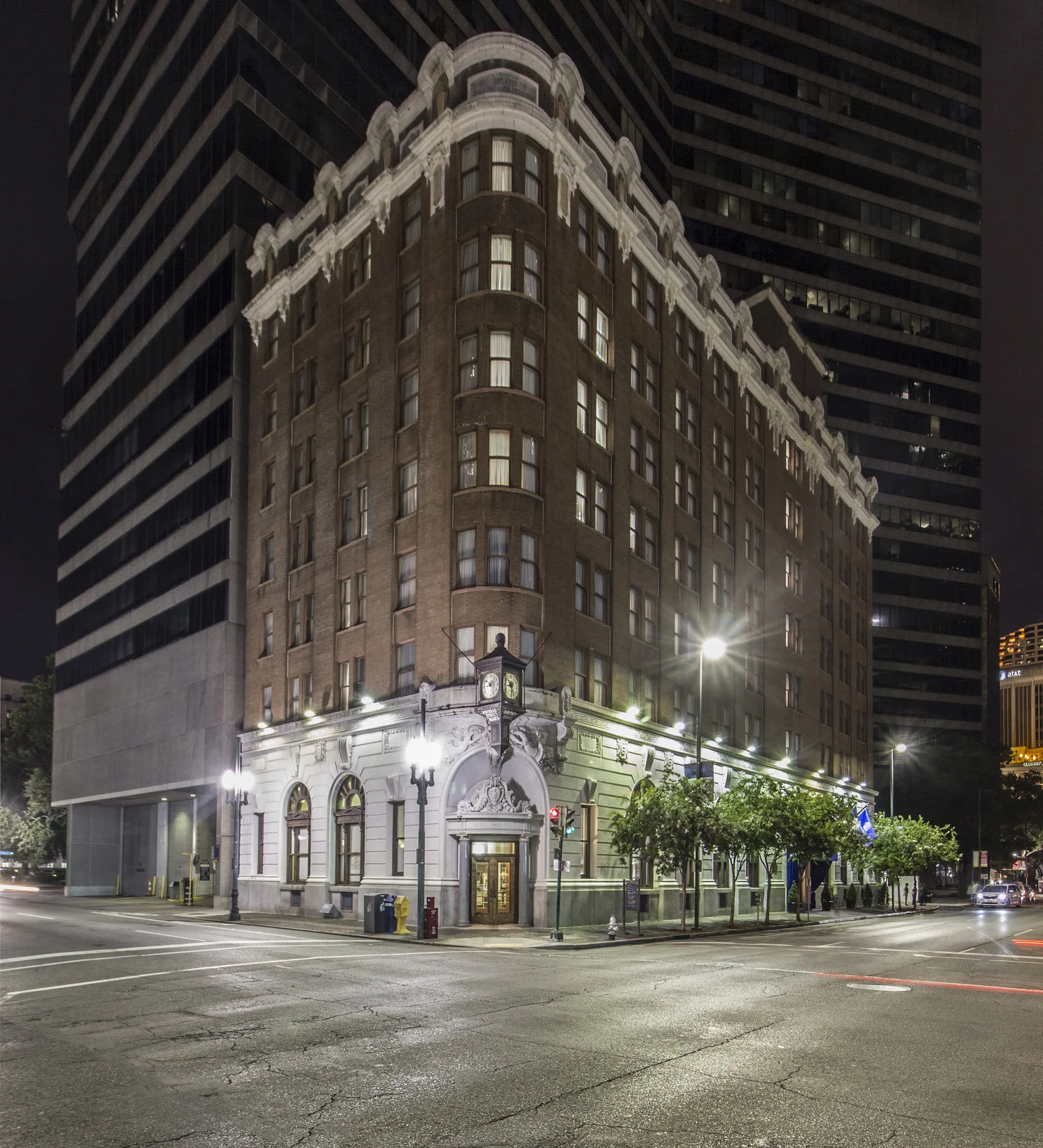“Night” shot taken at 4am to eliminate parked cars. Strong architectural style highlighted with forced perspective. By darkening nearby buildings, property stands out among competing surroundings.