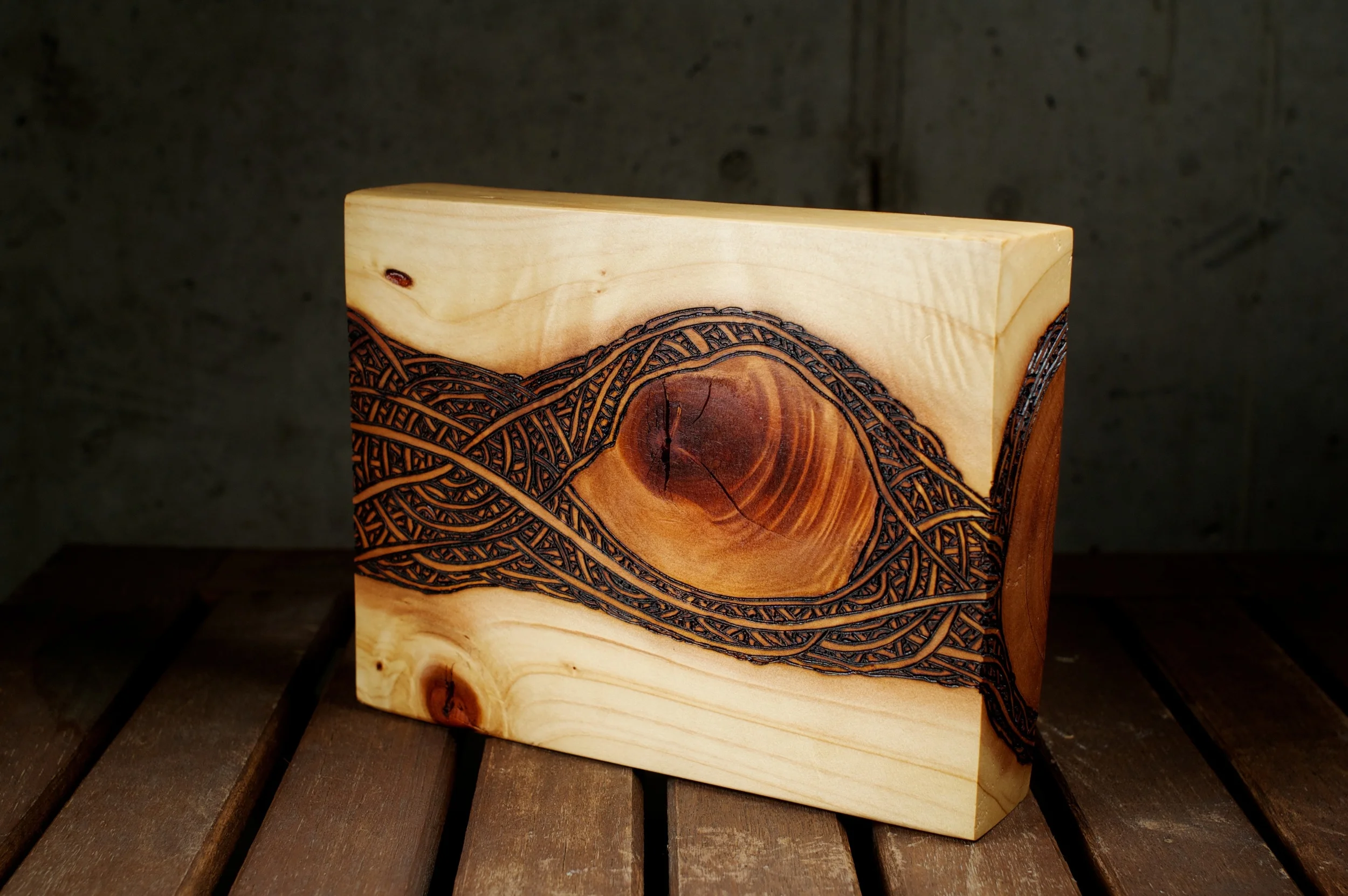 The Eye (2015) Wood Burning On Red Wood 7 in x 1 ½ in x 6 in $150.00 For Inquiry Email bzartsgallery@gmail.com