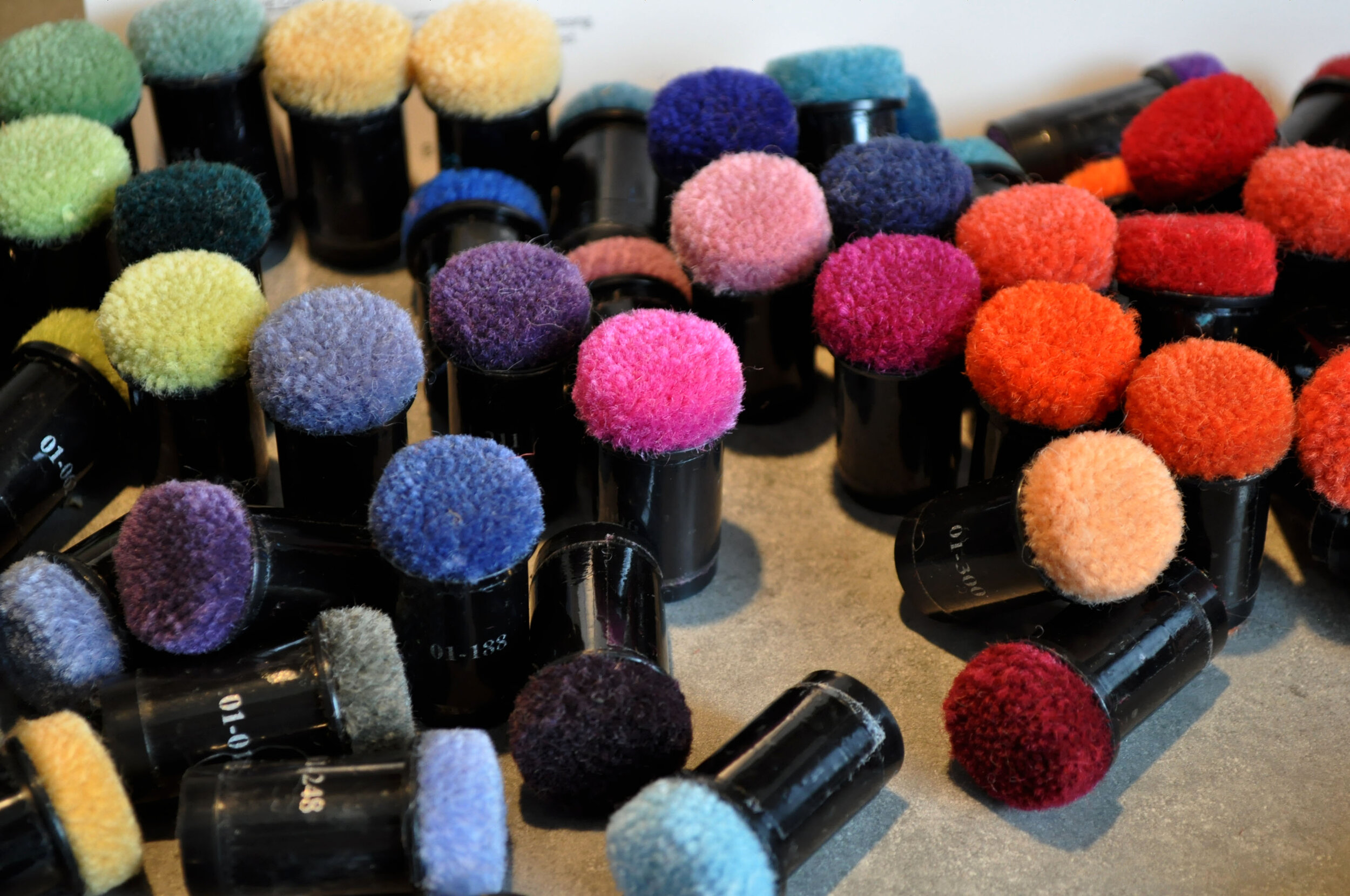  Colourful wool carpet poms used in the installation. 