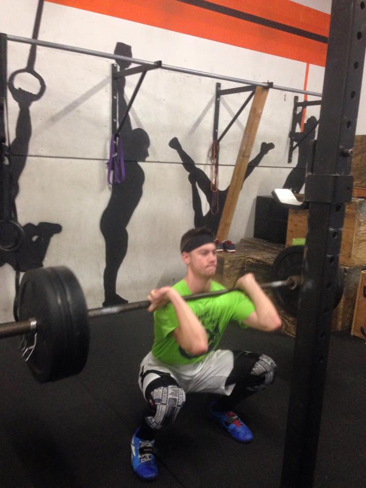 Austin exercising some awesome squat mechanics and excellent headband etiquette.
