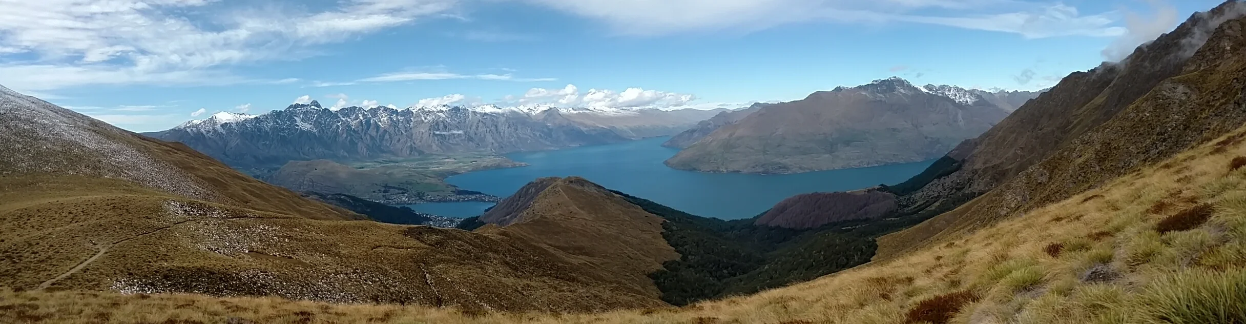 Panorama trail view of Queenstown, The Remarkables and Lake Wakatipu