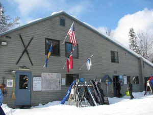 Lapland Lake’s eclectic row of flags reflects the international mindset of its founder, Olavi Hirvonen.