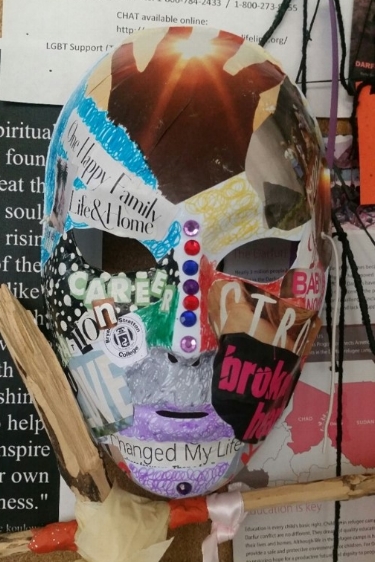PSYC 120 student work representing the "masks" we wear in life and how assumptions and stigma can affect the individual.