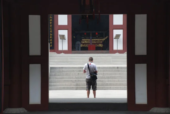 About to kneel in front of a giant Buddha at a monastery / temple on Purple Mountain in Nanjing.