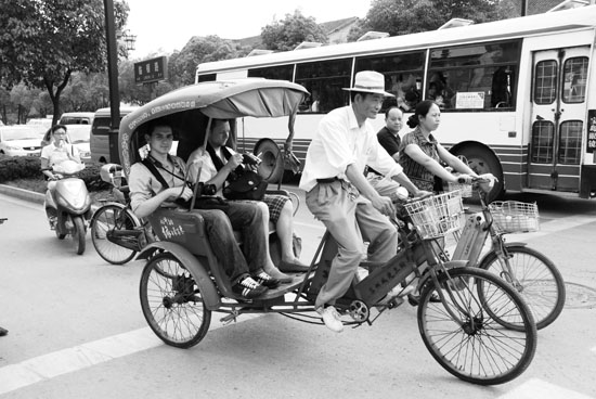 SN and I in a bike cab in Suzhou.