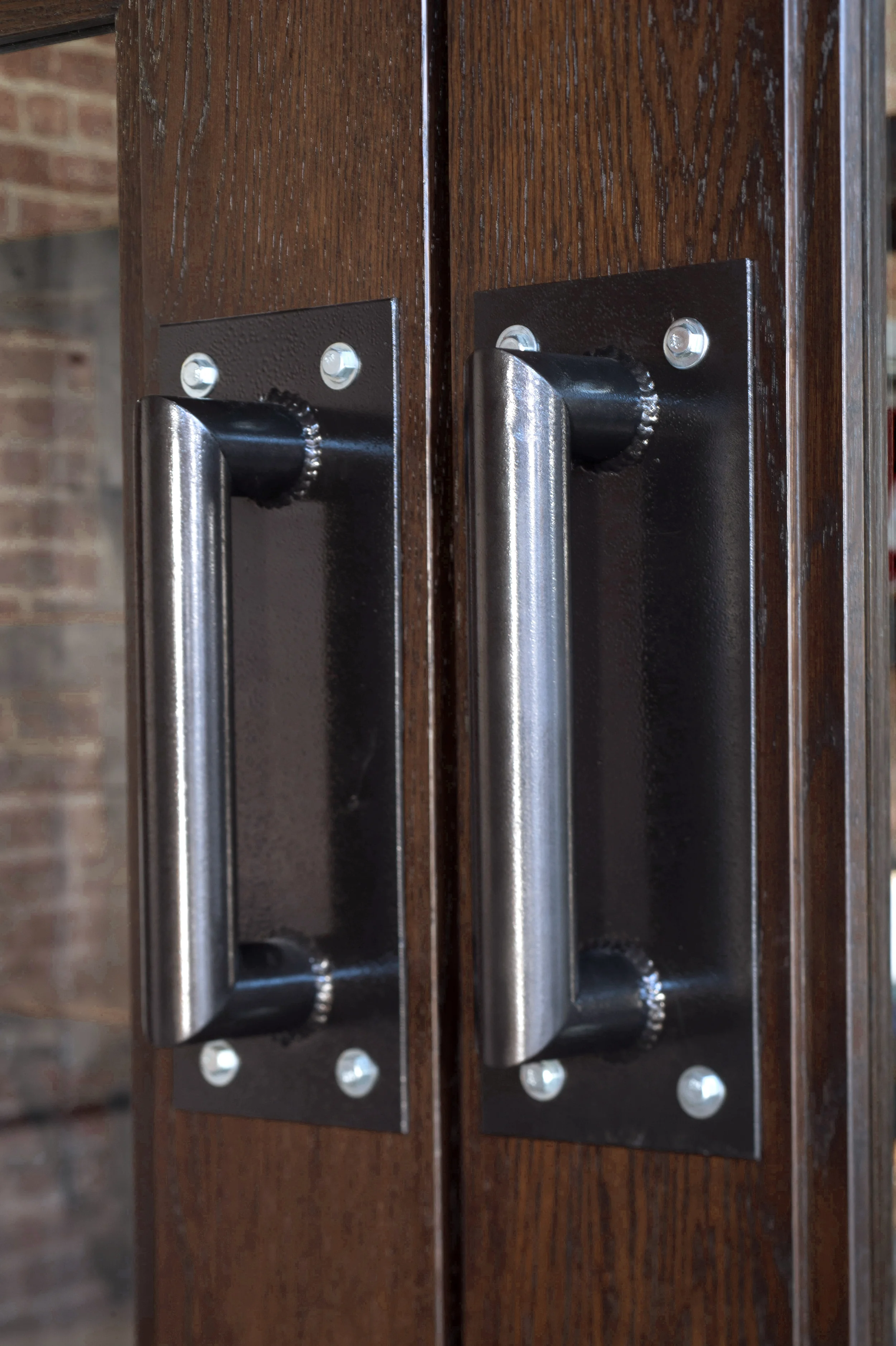  Custom handles for the new oak doors dividing the space. 