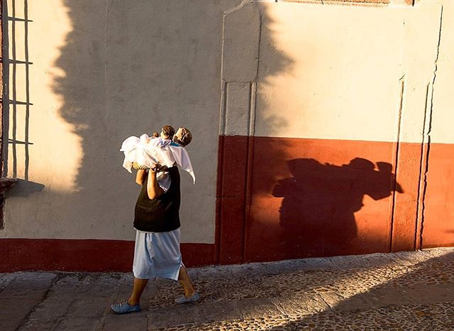 An elderly woman carrying baby dolls to a nearby church in San Miguel de Allende, Mexico.
These very artistically crafted baby dolls are being used as lucky charms to pray for children in the family.