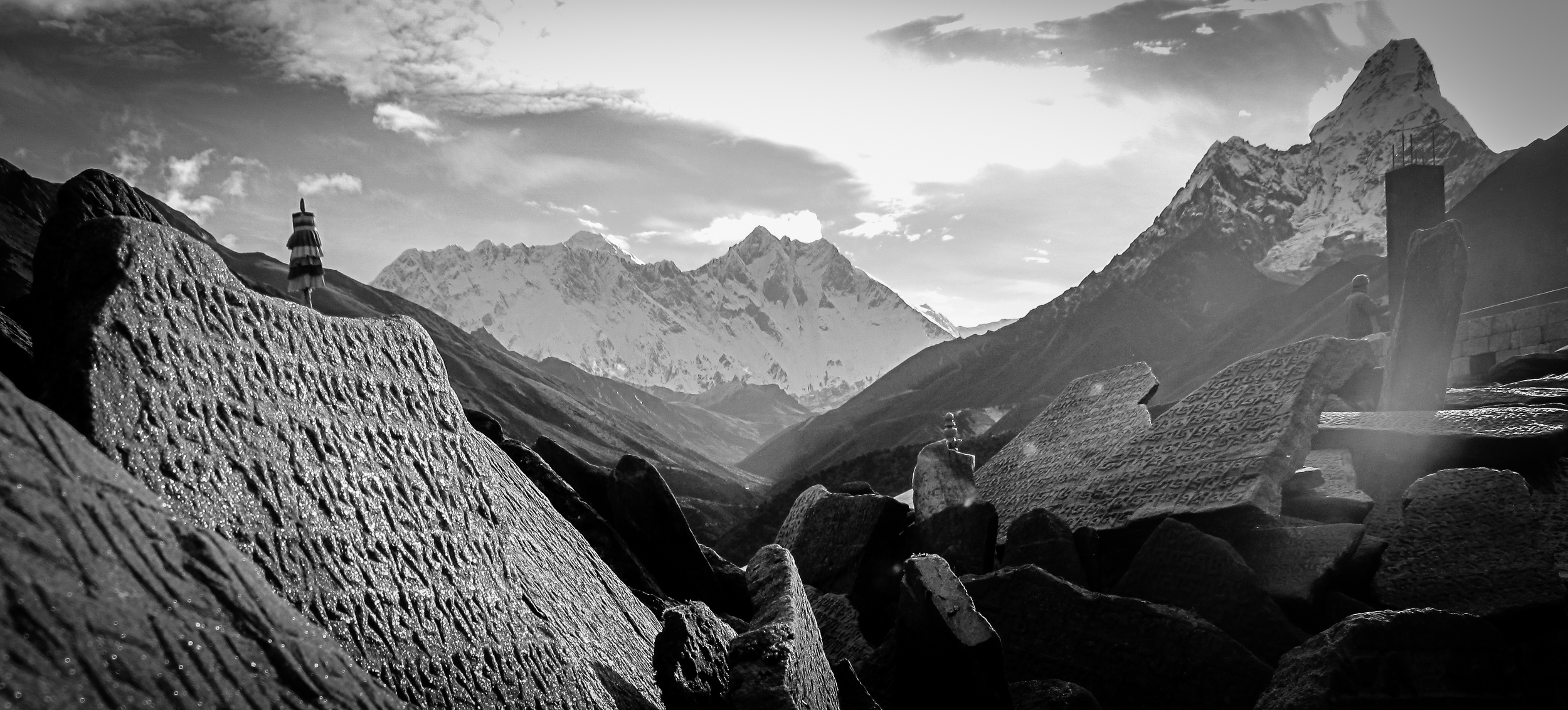 Sherpa script on stones below Mount Everest, Lhotse, and Ama Dablam, Nepal