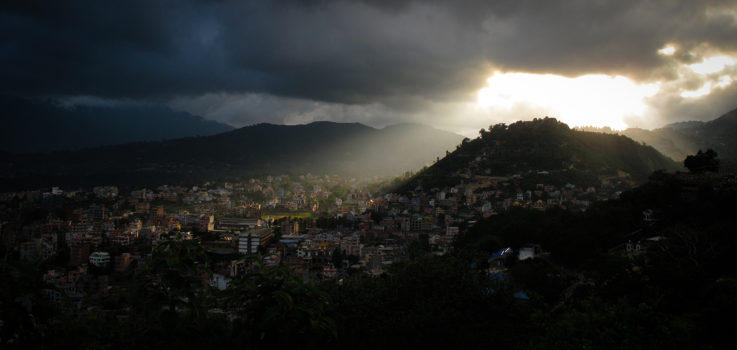 Light streaming through monsoon clouds, Kathmandu, Nepal