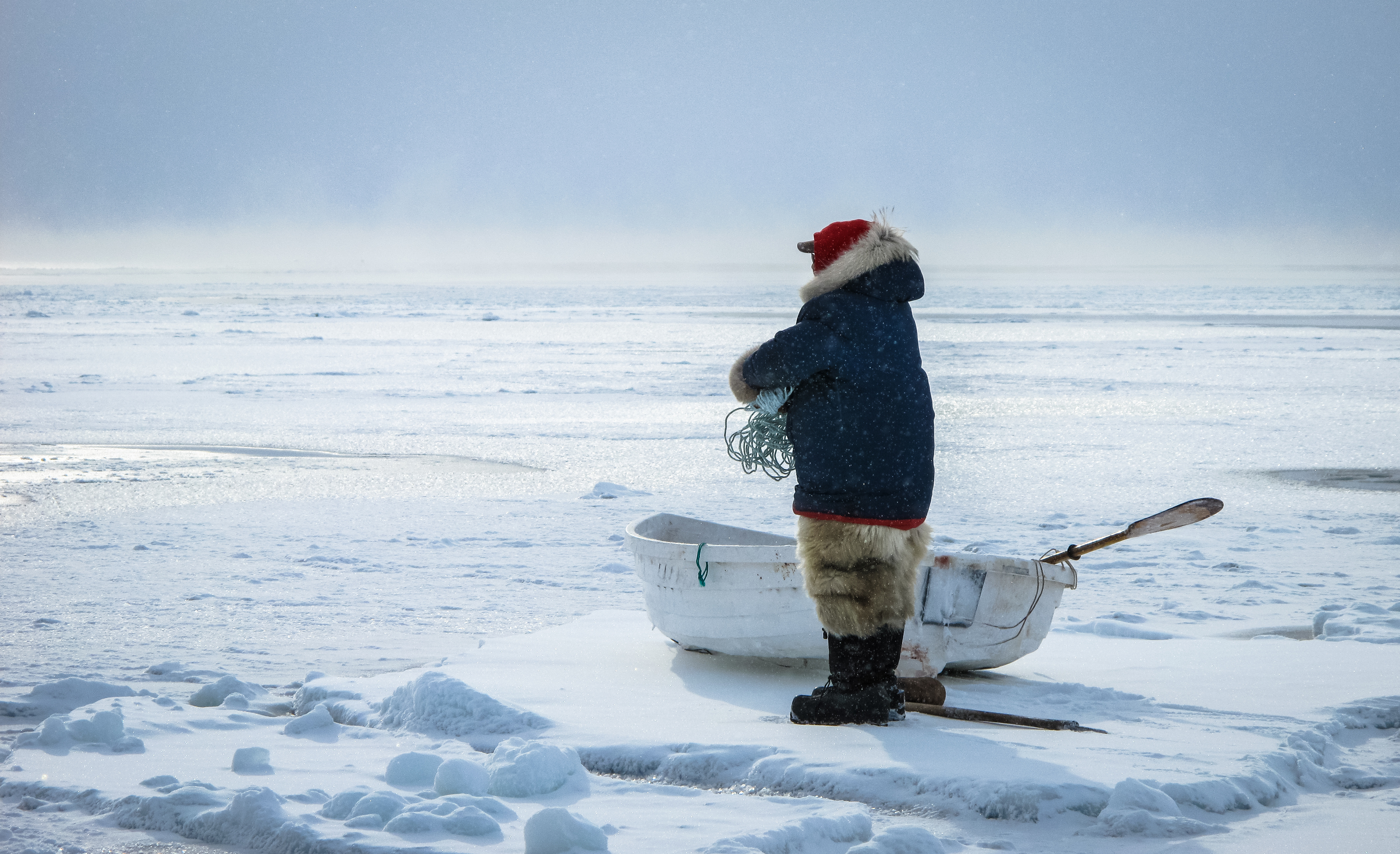 Planning passage over thin sea ice, Baffin Island, Canadian Arctic
