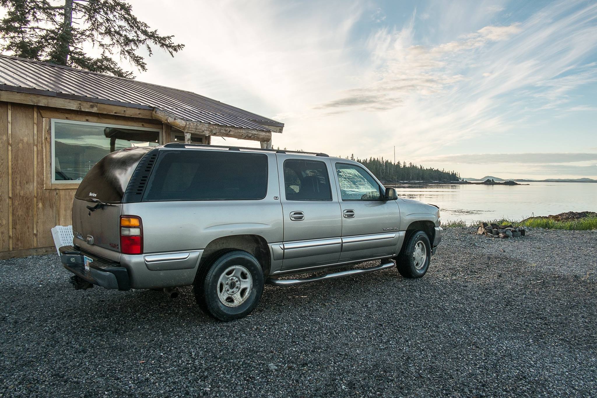 LOOKING AT THE VIEW FROM WHALE POINT CABI AND ONE OF THE CARS AVAILABLE FOR GUESTS TO LEASE. THE 260-MILE SCENIC BY-WAY, WILL BRING YOU THROUGH SOME BREATH-TAKING COUNTRY. IMAGE: THE WHALE POINT CABIN, COFFMAN COVE,