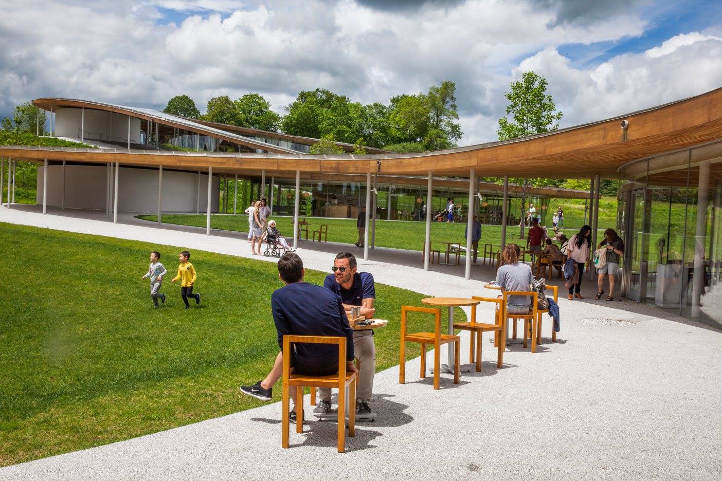 THE RIVER BUILDING, NESTLED INTO GRACE FARMS' UNDULATING LANDSCAPE, INCORPORATES A LIBRARY, A COURT/GYMNASIUM SIMULTANEOUSLY BELOW GROUND AND OPEN TO THE SKY, A COMMONS (STOP IN FOR FRESHLY PREPARED SNACKS AND FOOD, A PAVILION WHERE TEA IS A CELEBRATION, THE SANCTUARY AND A LIBRARY. DESIGNED BY SANAA ARCHITECTS TO BE ENVIRONMENTALLY FRIENDLY, IT IS CURRENTLY UNDER LEED REVIEW. IMAGE: VANESSA VAN RYZIN, COURTESY OF GRACE FARMS