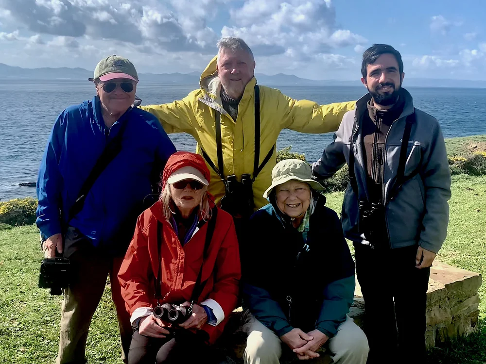 Larry, Alan, Nacho, Carol and Liz huddle at the Strait