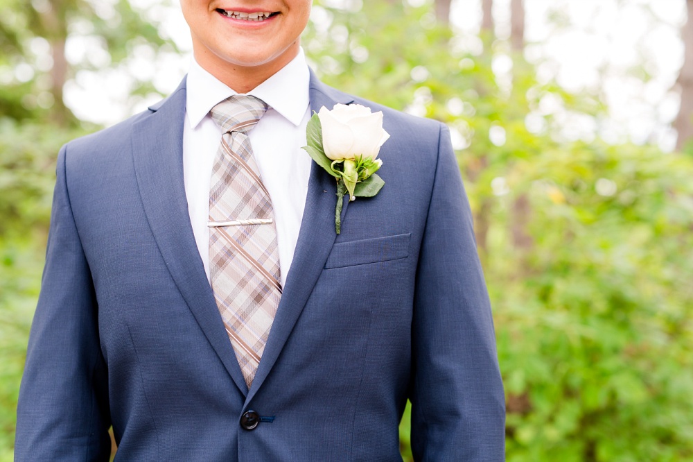 Wolf Lake, MN Country Styled Wedding, White Dress, Blue Suite | Photographed by Amber Langerud Photography | Close Up of Groom's Boutonniere