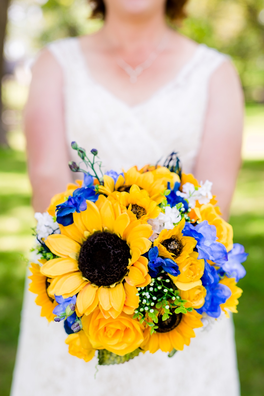 Detroit Lakes, MN Country Styled Wedding at Trinity Lutheran Church &amp; Holmes Ballroom Photographed by Amber Langerud Photography | bride holding bouquet
