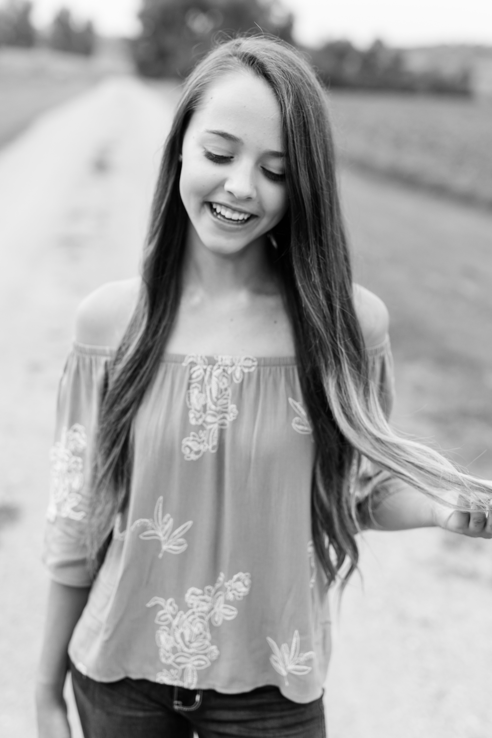 Dance and Country Styled High School Senior Session by Amber Langerud Photography near Audubon on a gravel road | Riley