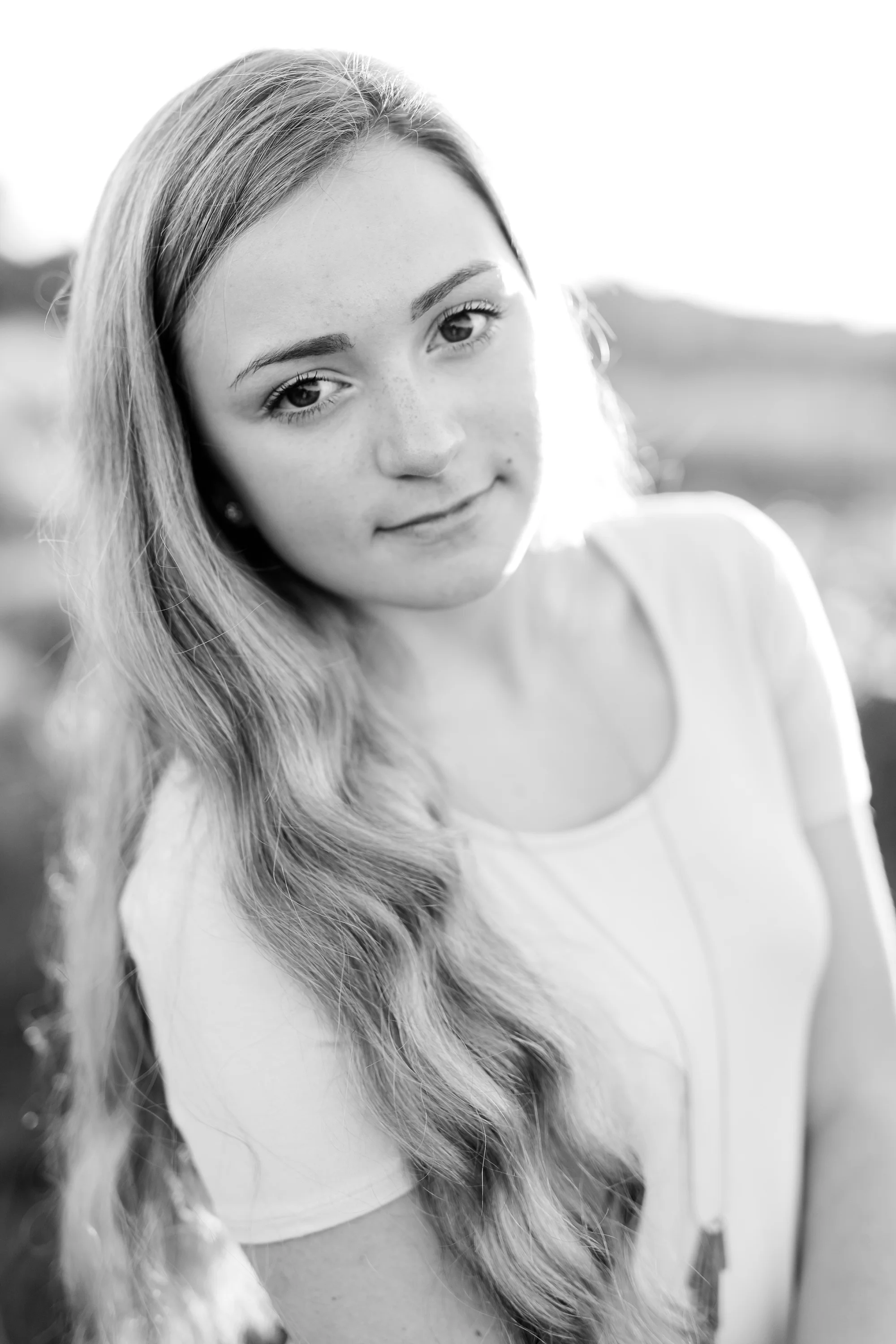 Country Styled High School Senior Pictures on a Farm and Little Cormorant Lake in Minnesota by Amber Langerud with Grass Background