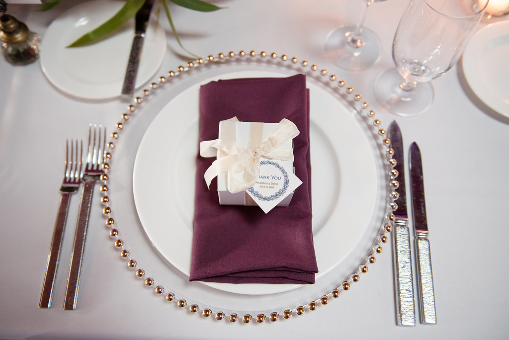 Within Sodo Wedding | Place Setting | Wedding Favor Box | Plum Napkin on Gold Charger | Affinity Photography | Seattle Wedding Planner | New Creations Weddings