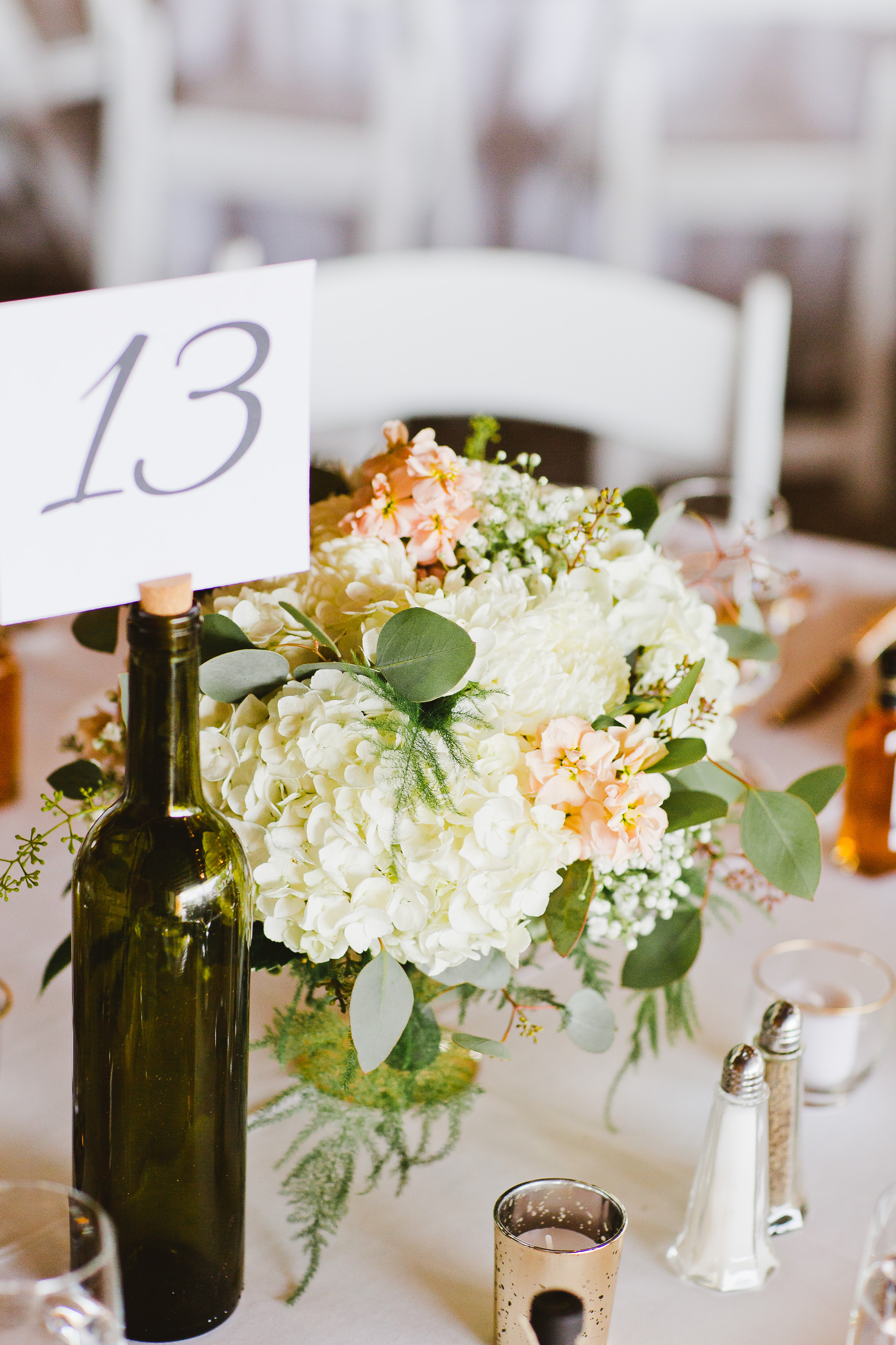 Wine Bottle Table Number | Blush and Ivory Centerpiece | Rustic Wedding Centerpiece | Asgari Photography | Swans Trail Farm Snohomish Wedding | Snohomish Wedding Planner | Seattle Wedding Planner