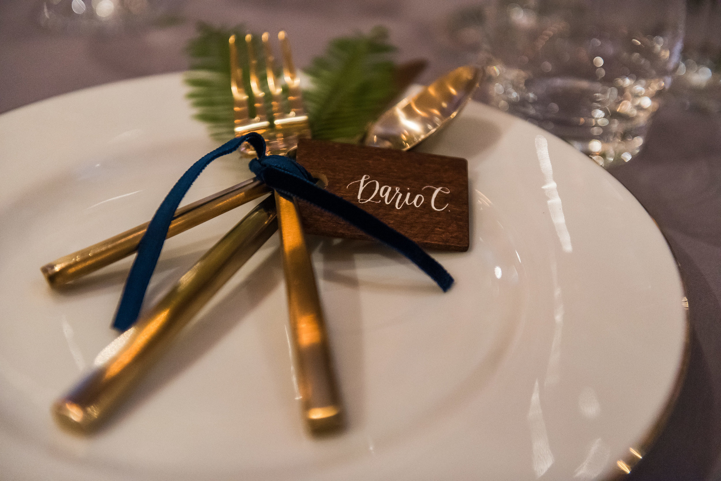 Gold siverware place setting with velvet ribbon wedding.jpg