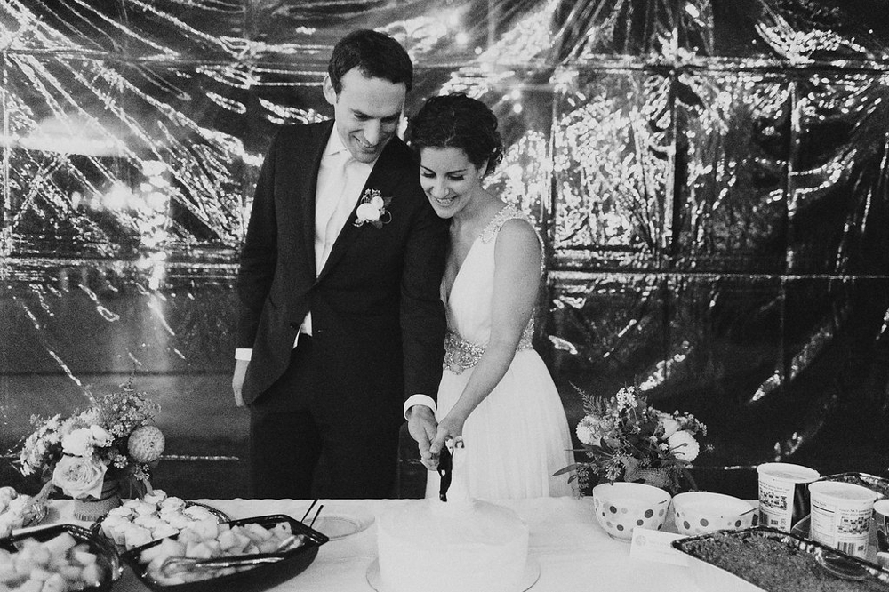 Bride and Groom Cutting their Cake at Jewish Wedding