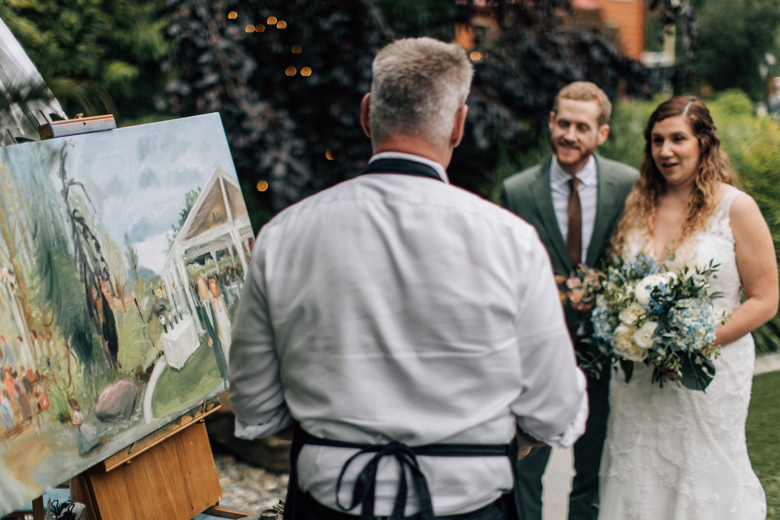 On-site wedding painter Sam Day at Twin Willow Gardens