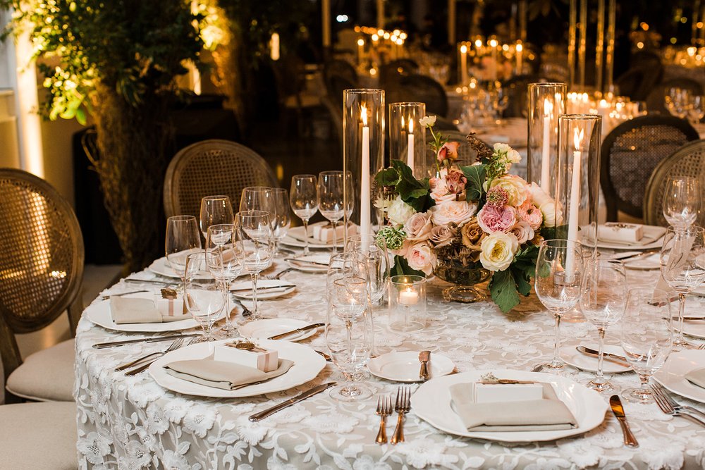 Floral and taper candle centerpiece at Chihuly Garden and Glass Wedding