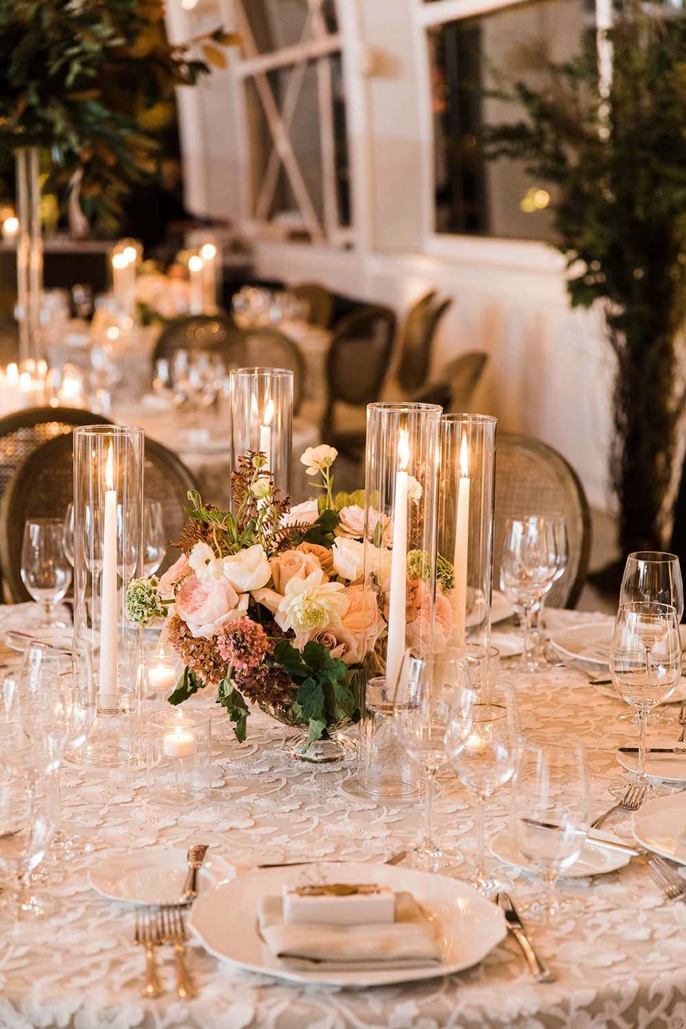 Garden style centerpiece in blush, ivory and greens at Chihuly wedding