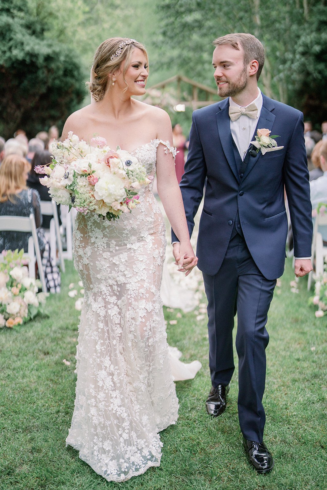 Romantic outdoor wedding with blush, white and green floral