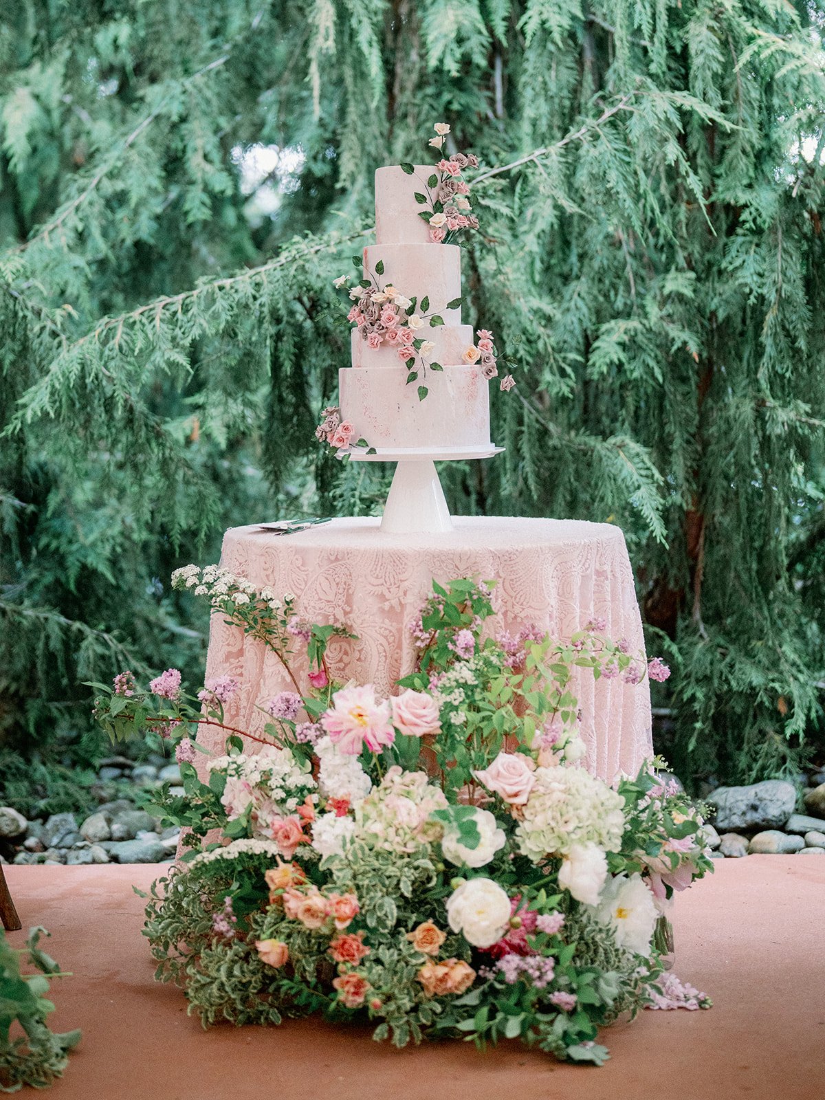 White Wedding Cake with blush flowers