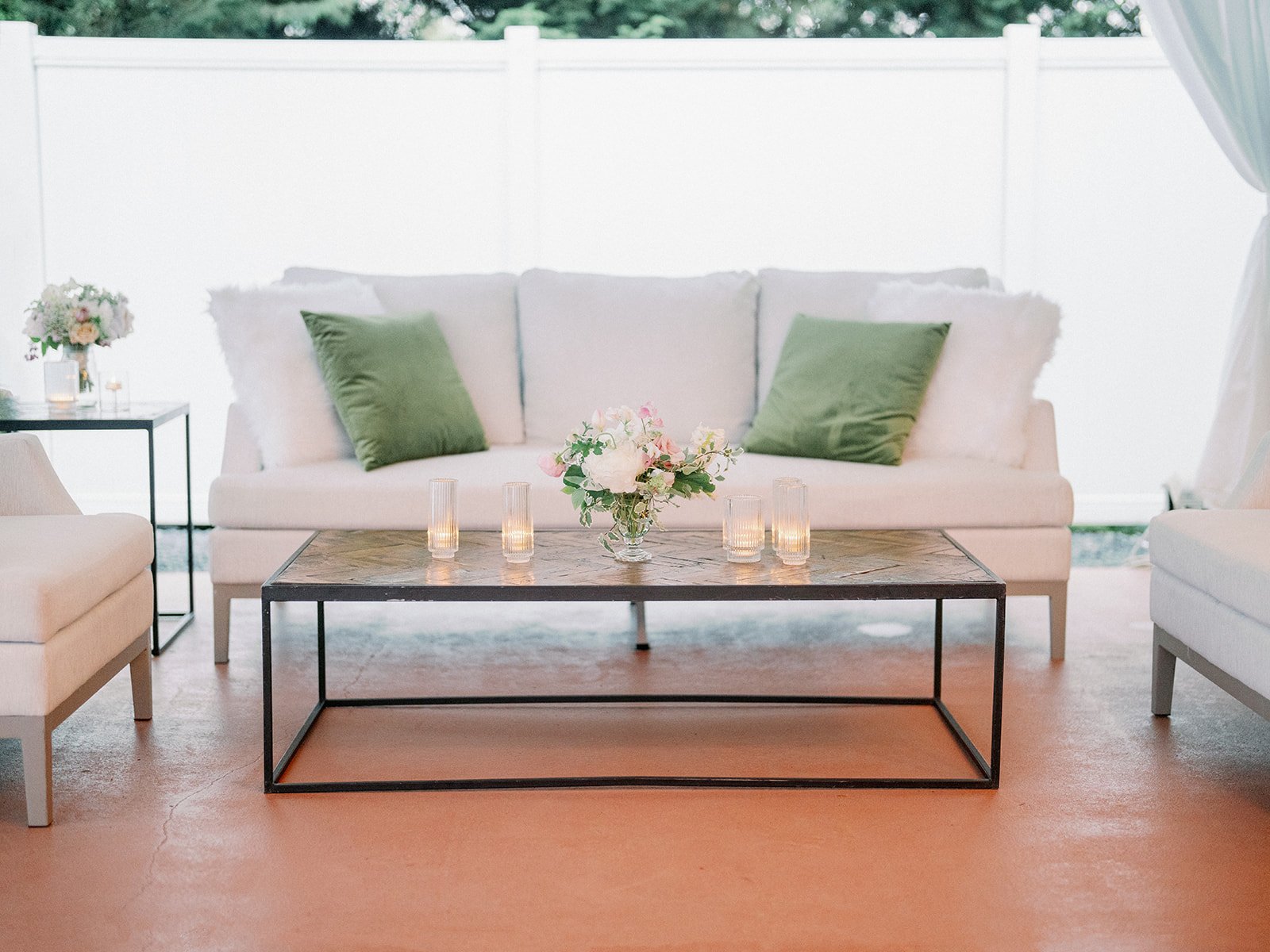 White Lounge Seating Area with Green Throw Pillows Wedding