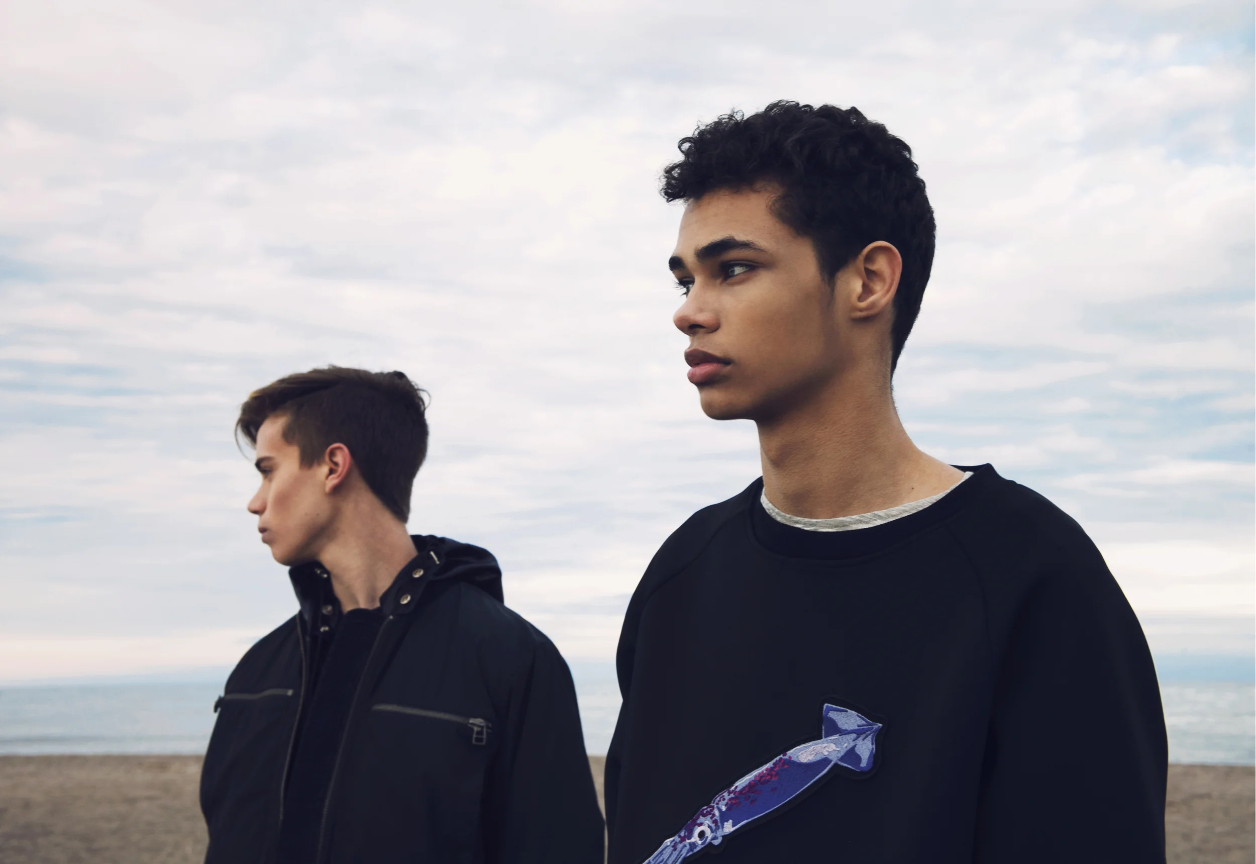 On Tannor: jacket ALEXANDER WANG, hooded jacket (underneath) ANDREW COIMBRA On Ty: sweater ANDREW COIMBRA, shirt ALEXANDER WANG