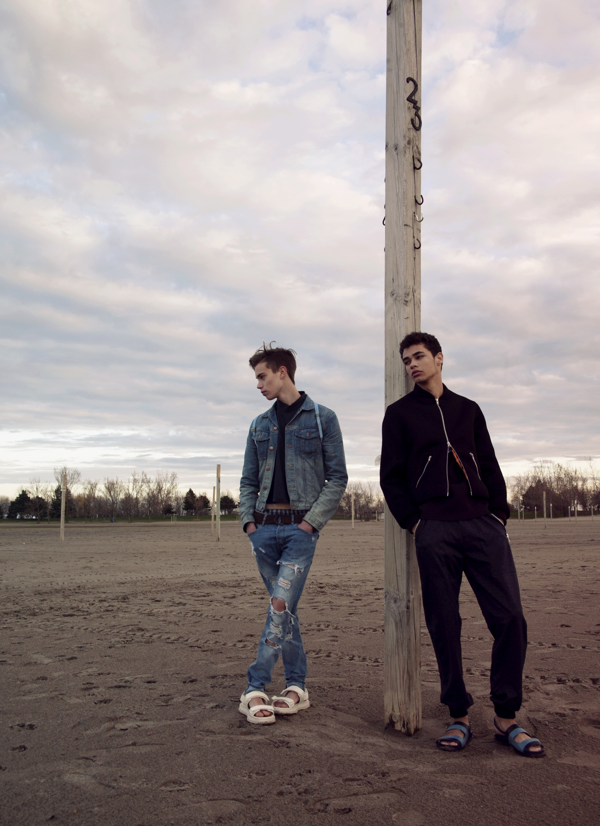 On Tanner: denim jacket SAINT LAURENT, cropped turtlneck ANDREW COIMBRA, jeans A.P.C, sandals GIVENCHY, bag OPELLE CREATIVE, belt DIESEL On Ty: Mesh jacket and joggers ANDREW COIMBRA, top SAINT LAURENT, sandals PRADA