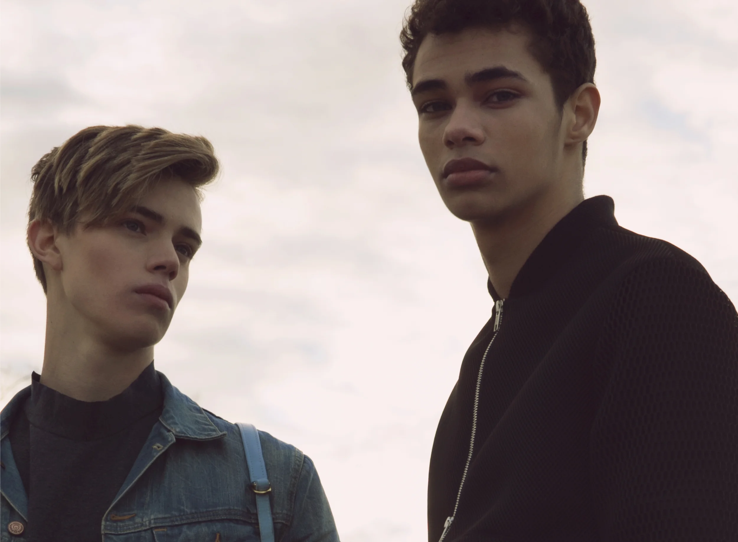 On Tannor: denim jacket SAINT LAURENT, turtleneck ANDREW COIMBRA, bag OPELLE CREATIVE On Ty: mesh jacket ANDREW COIMBRA