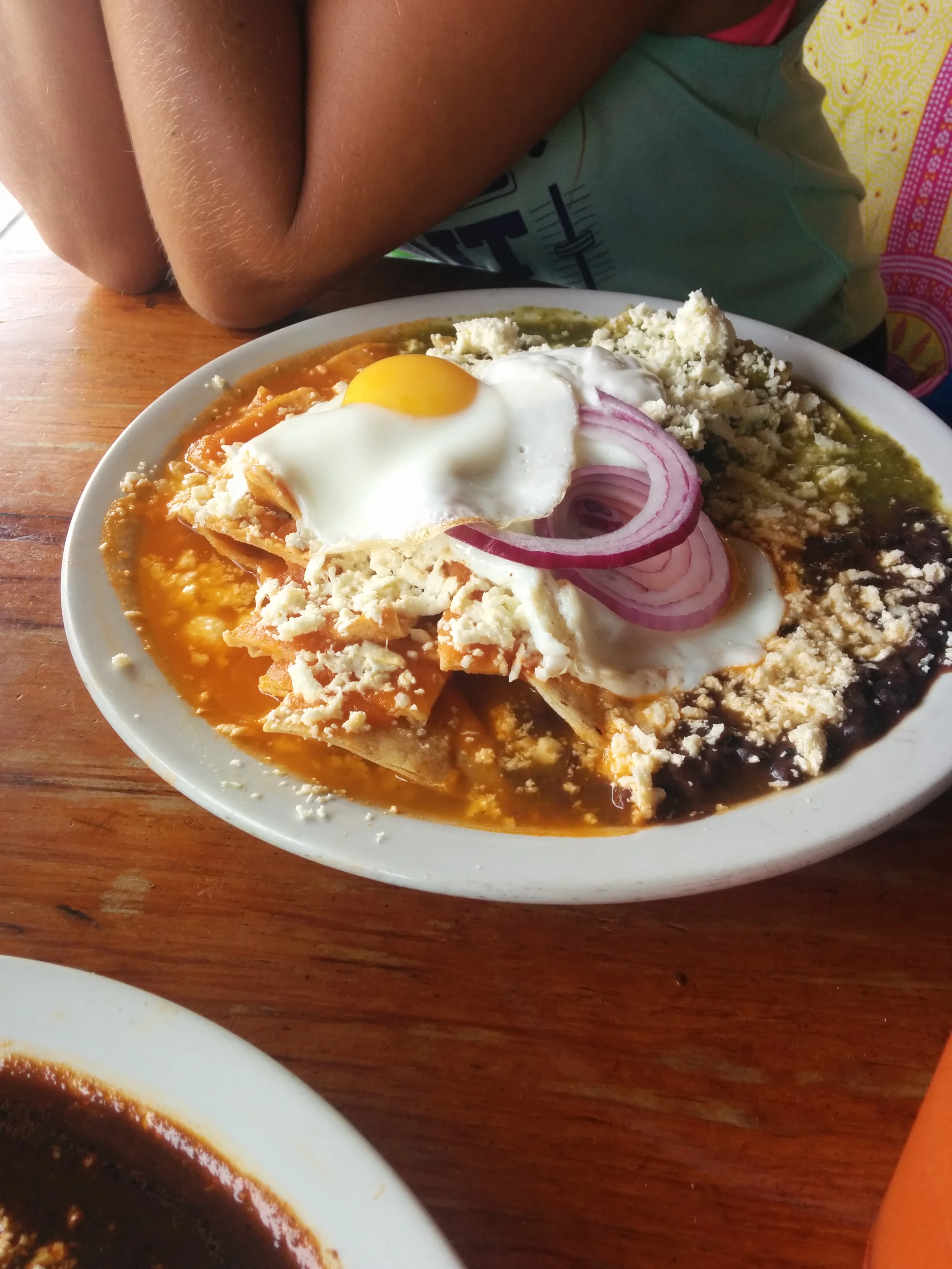  Chilaquiles. Famous for its curative hangover properties. Take day old tortillas, cut into triangles, fry them and serve them in red or green salsa. Top with egg and cheese. ....I can't look at this anymore. 