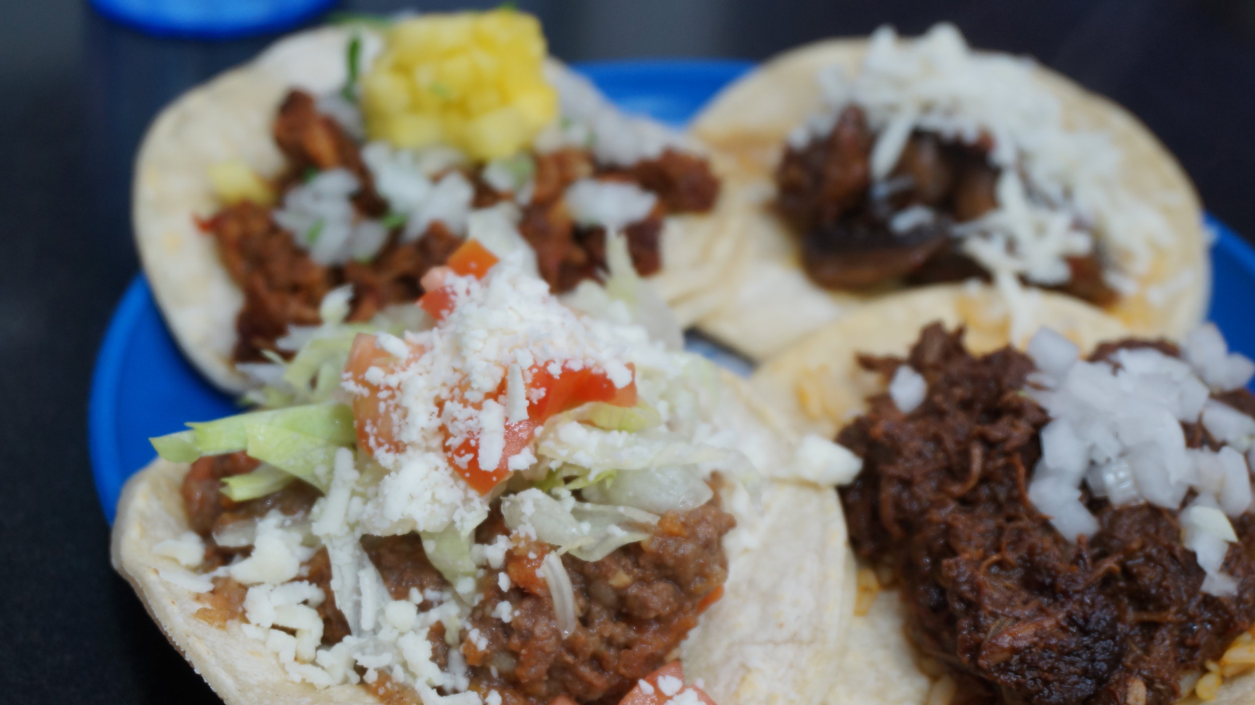  Chicken Mole, Pinapple Asado Pork, Mushroom and Beef &amp; Cheese tacos 