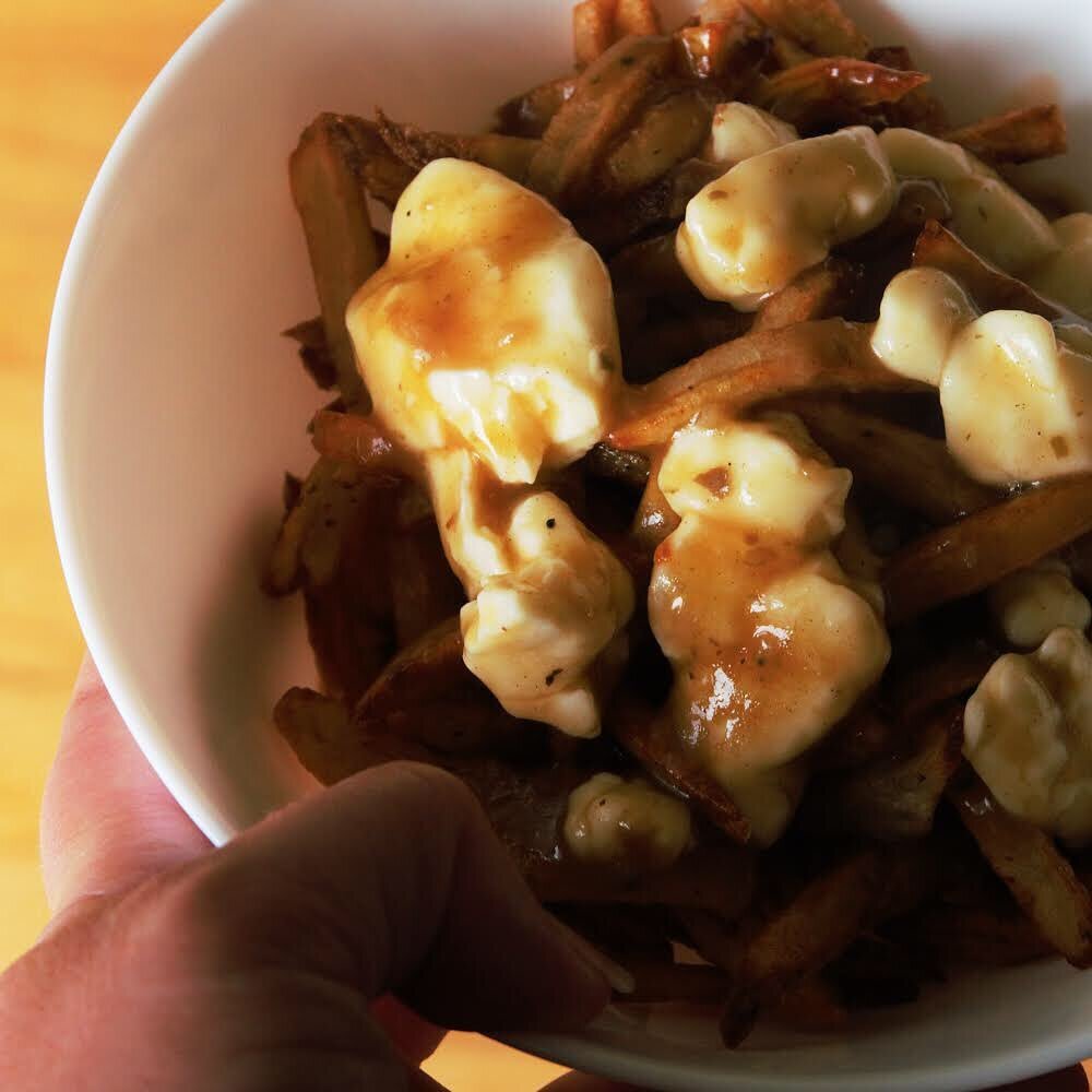 POV: On a road trip in Quebec / Ontario

Poutine is the ubiquitous national (fast food) dish of Canada. Fresh squeaky cheese curds, hot gravy and fresh fries!

I tried my hand at making Chuck Hughes poutine recipe on my twitch stream on Canada Day an